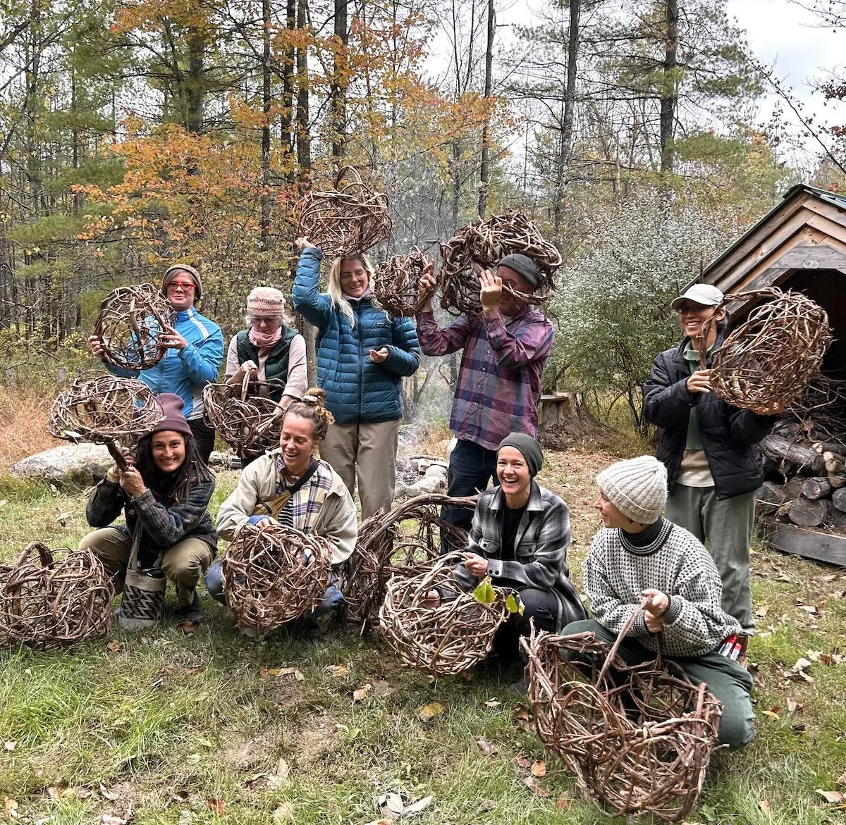 a group of students in a random weave basketry class