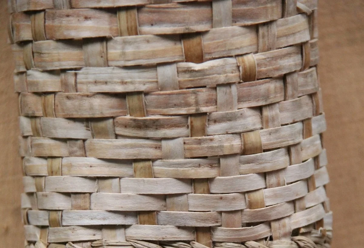 a closeup of the texture of white ash inner bark in a woven basket