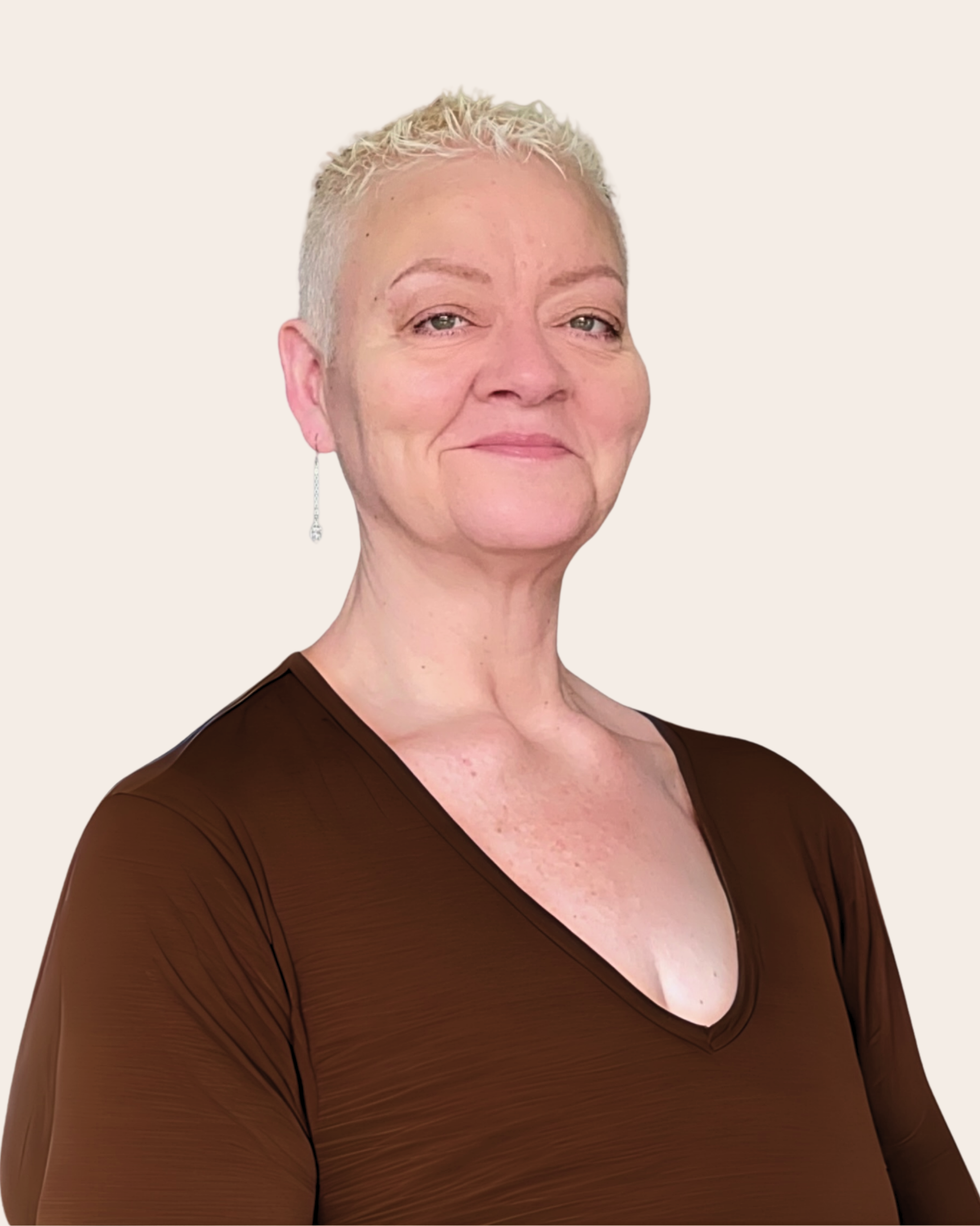 A portrait of a woman with short platinum blonde hair, wearing a dark brown top and a long dangling earring, smiling subtly against a plain light background.