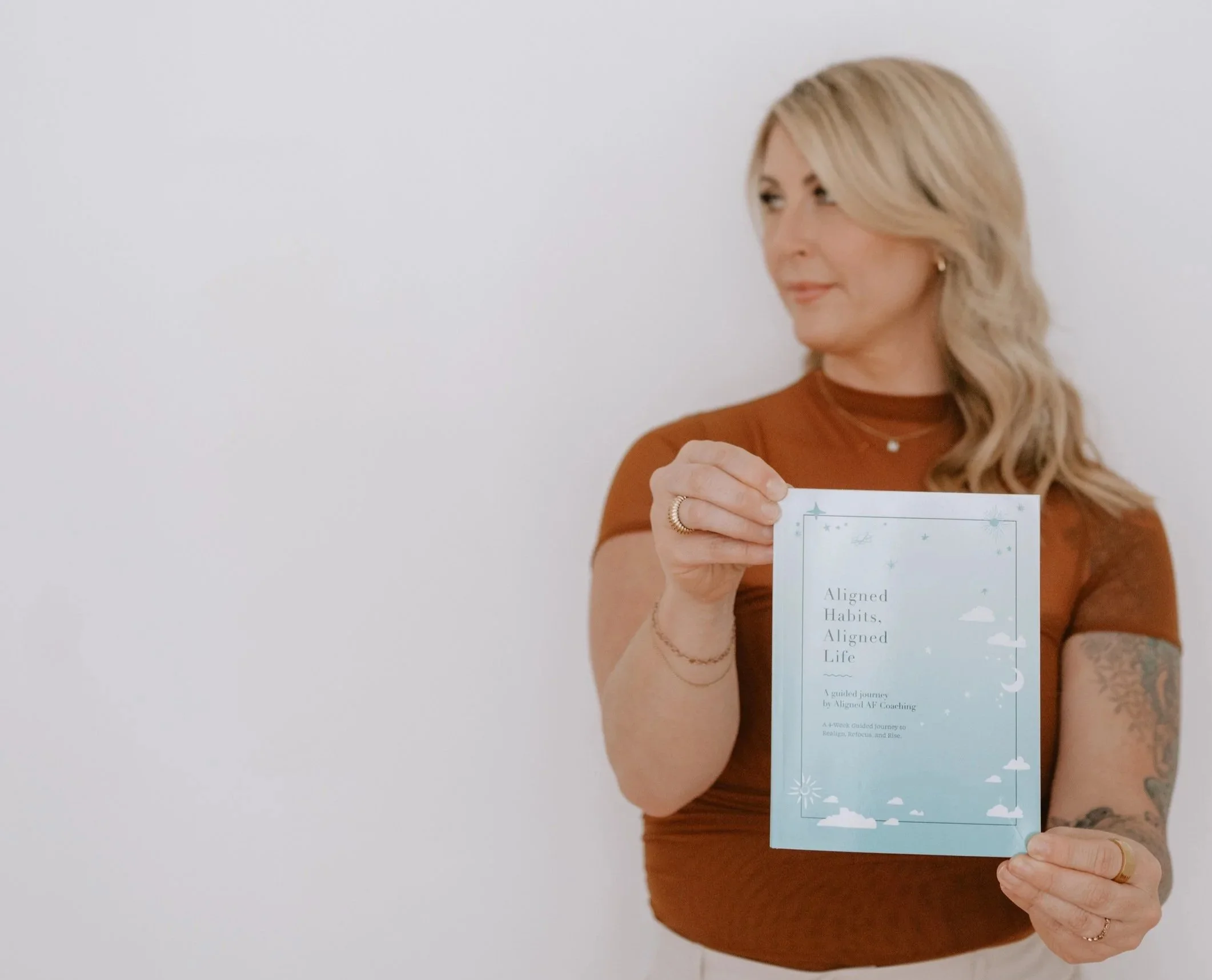 Journal launch photoshoot for Aligned AF featuring guided prompts for self-reflection and personal alignment