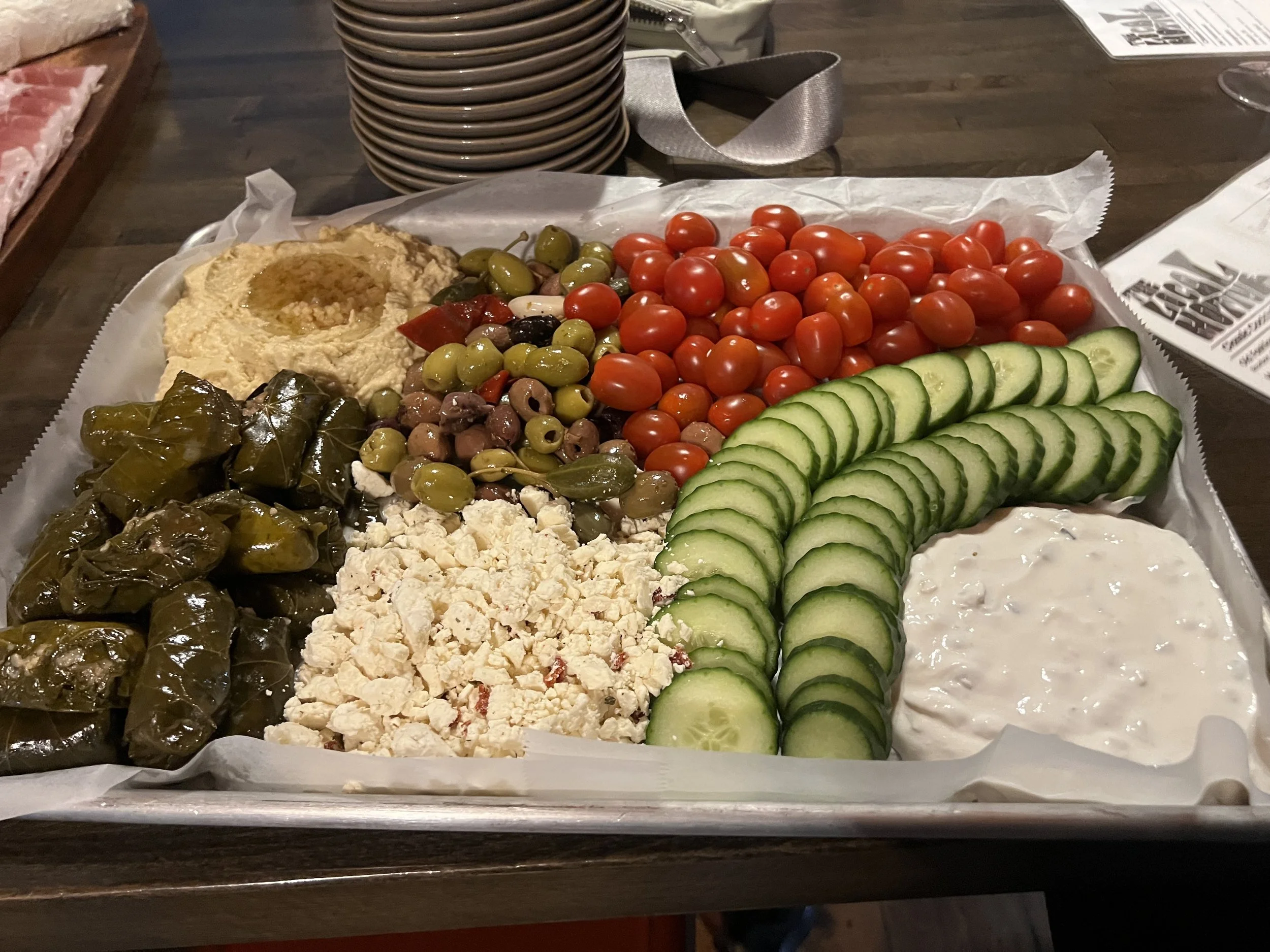Artfully arranged charcuterie boards at Local Motive shared among Sweat Crawl participants during a post-workout social celebration