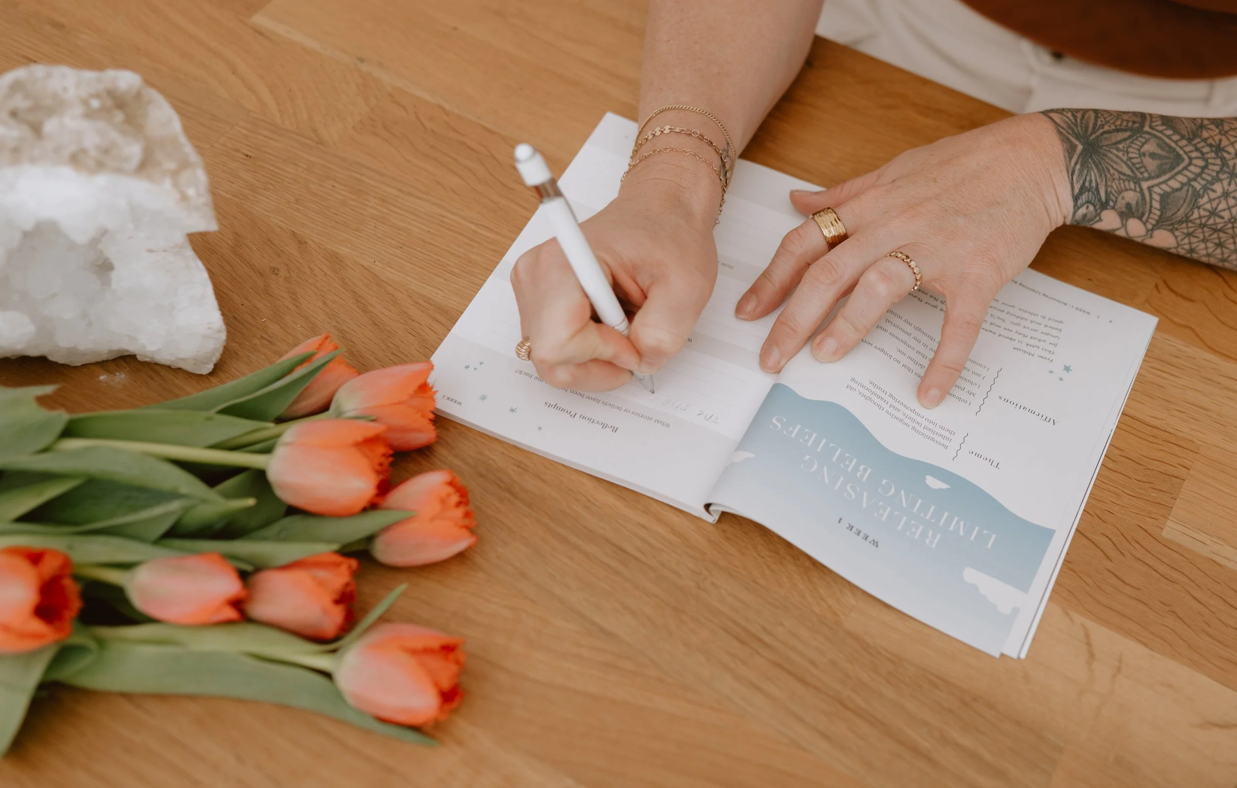 Lifestyle imagery of the Aligned AF journal designed for daily reflection, habit building, and personal growth