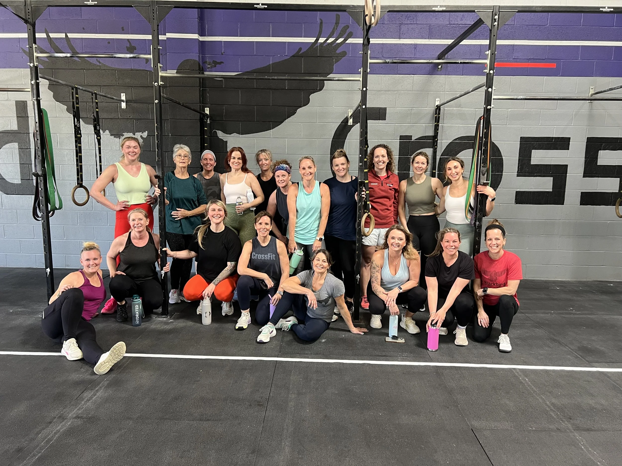 High-energy Sweat Crawl workout session featuring functional fitness training at a CrossFit gym