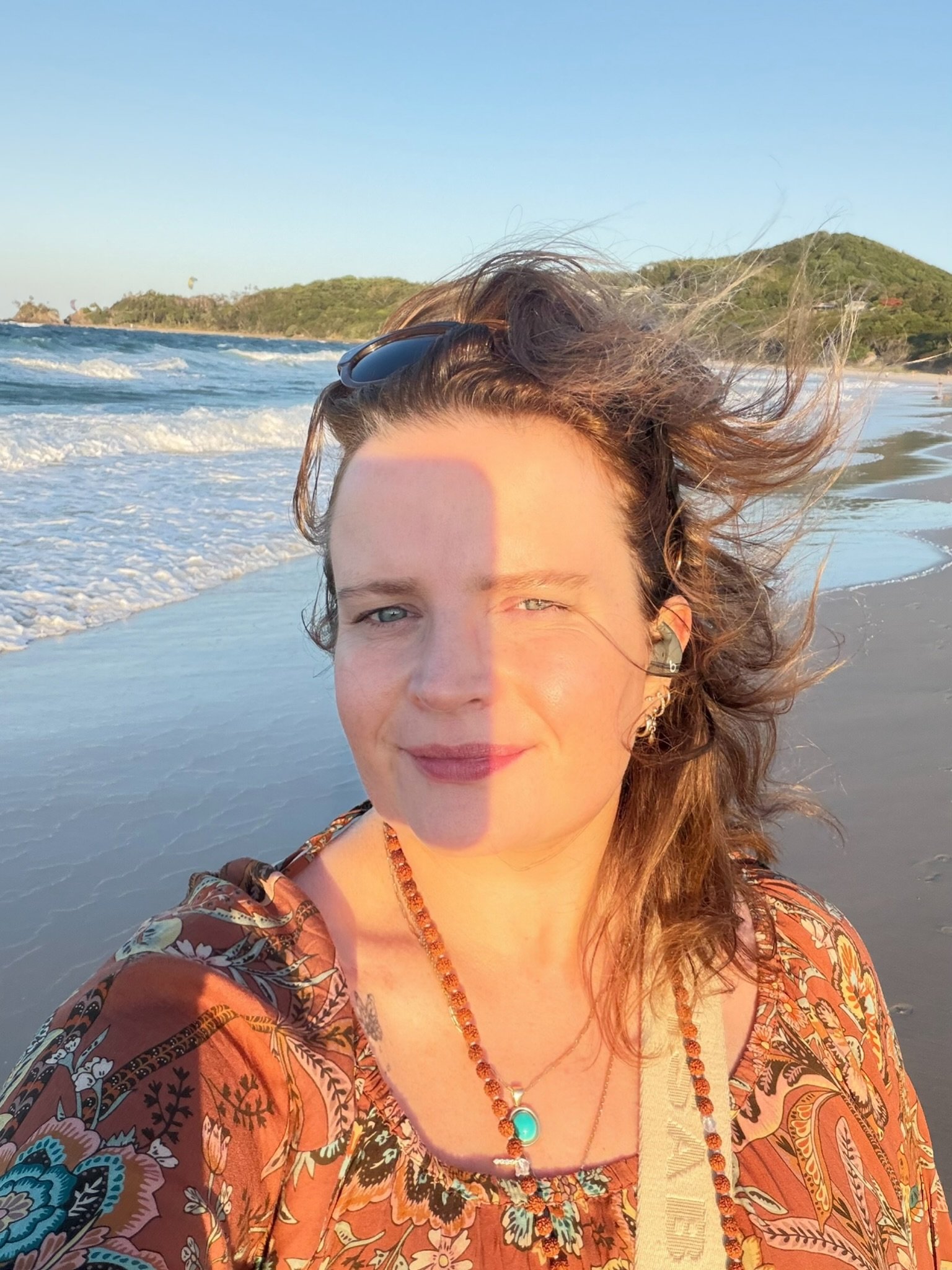 Melena Birtles on a beach at sunset.