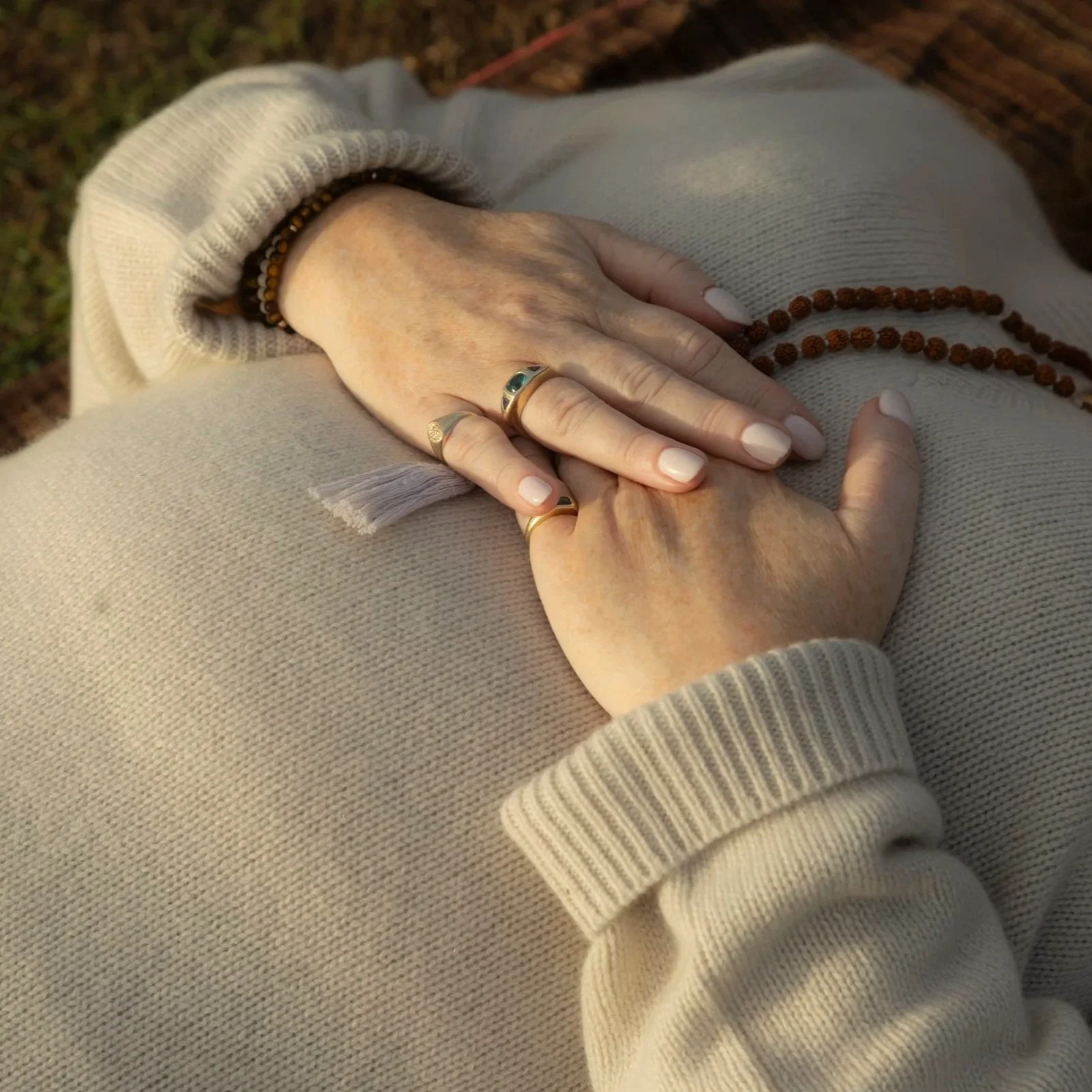 Hands resting gently during a New Day Vibes guided breathwork and meditation practice