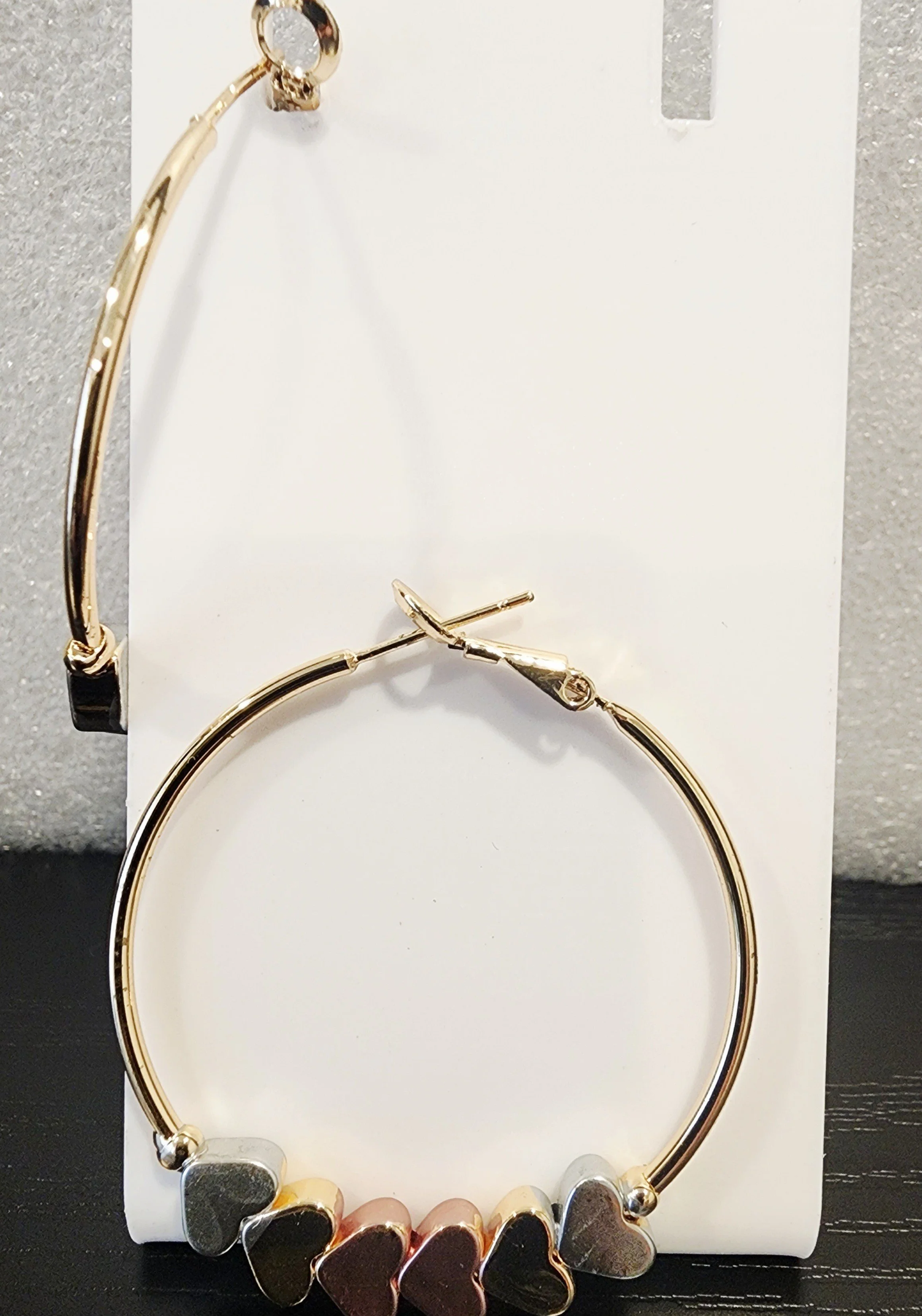 Gold earring heart shaped