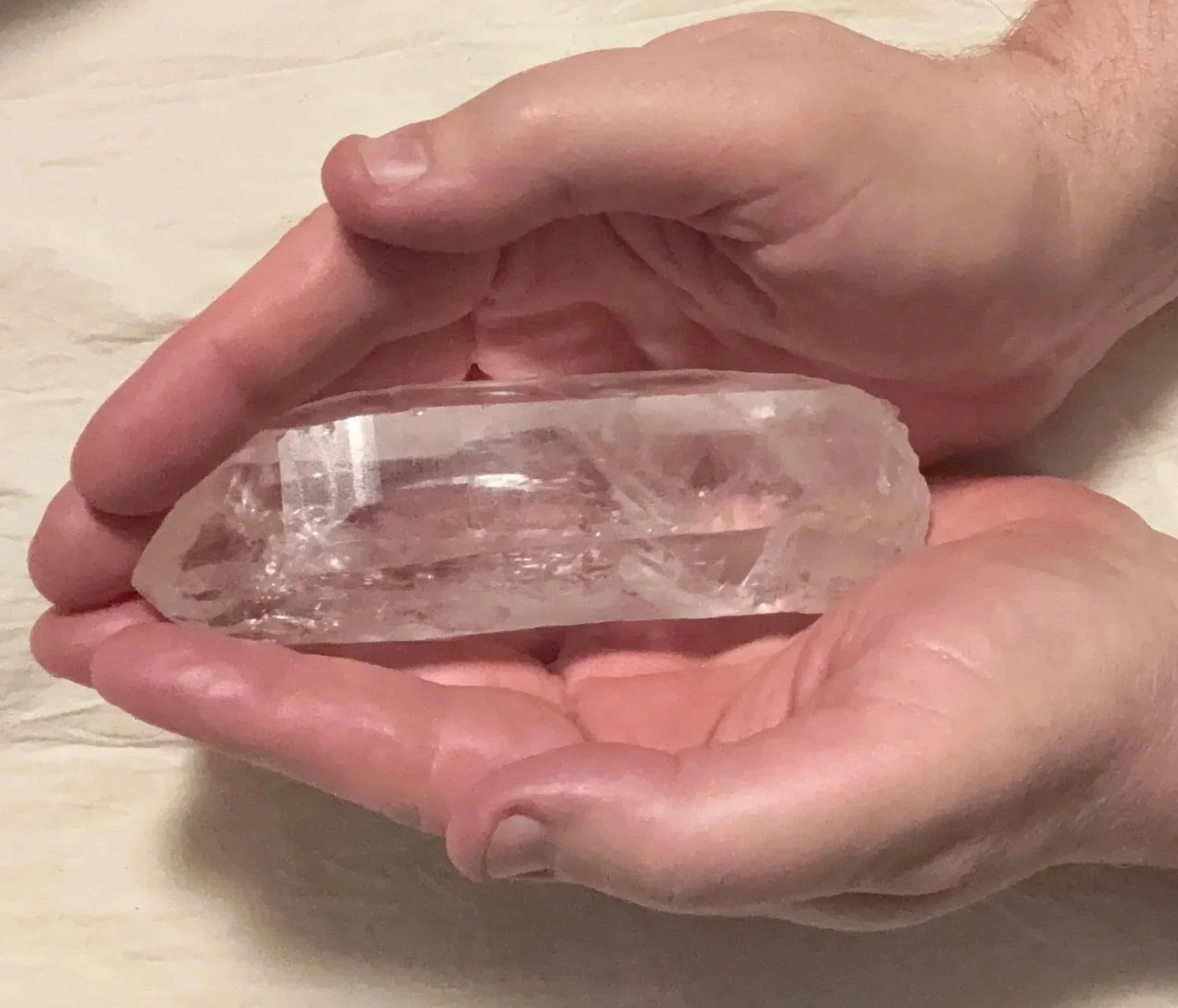 Charles Decáte holding a Lemurian quartz crystal used for Reiki, meditation,  and practices within the Temple Series.