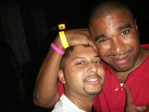 Norega & BIJAL, a DJ,  taking a close-up selfie together at an event together.