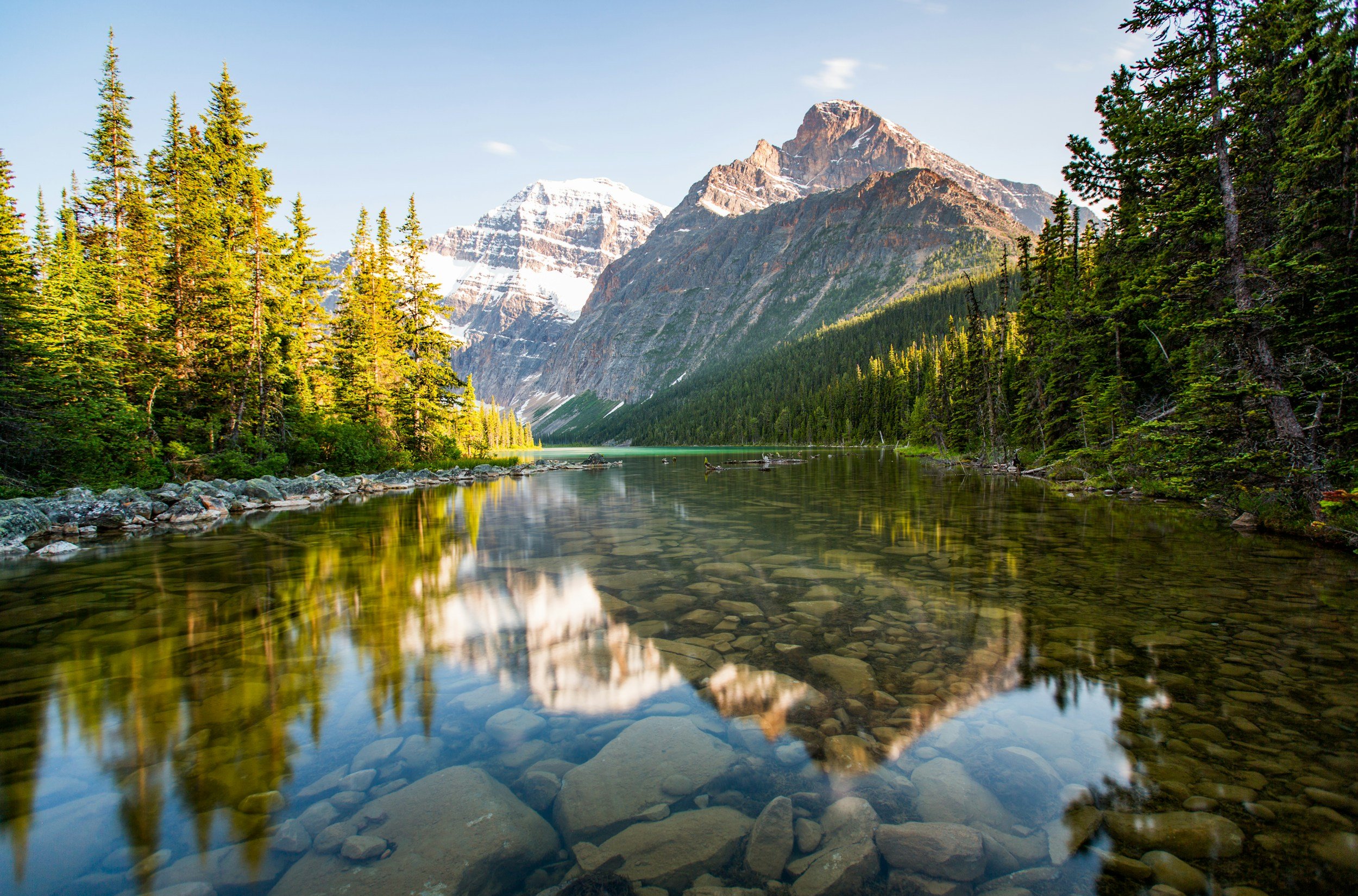 Scenic view of Edmonton river surrounded by lush trees and natural landscape
