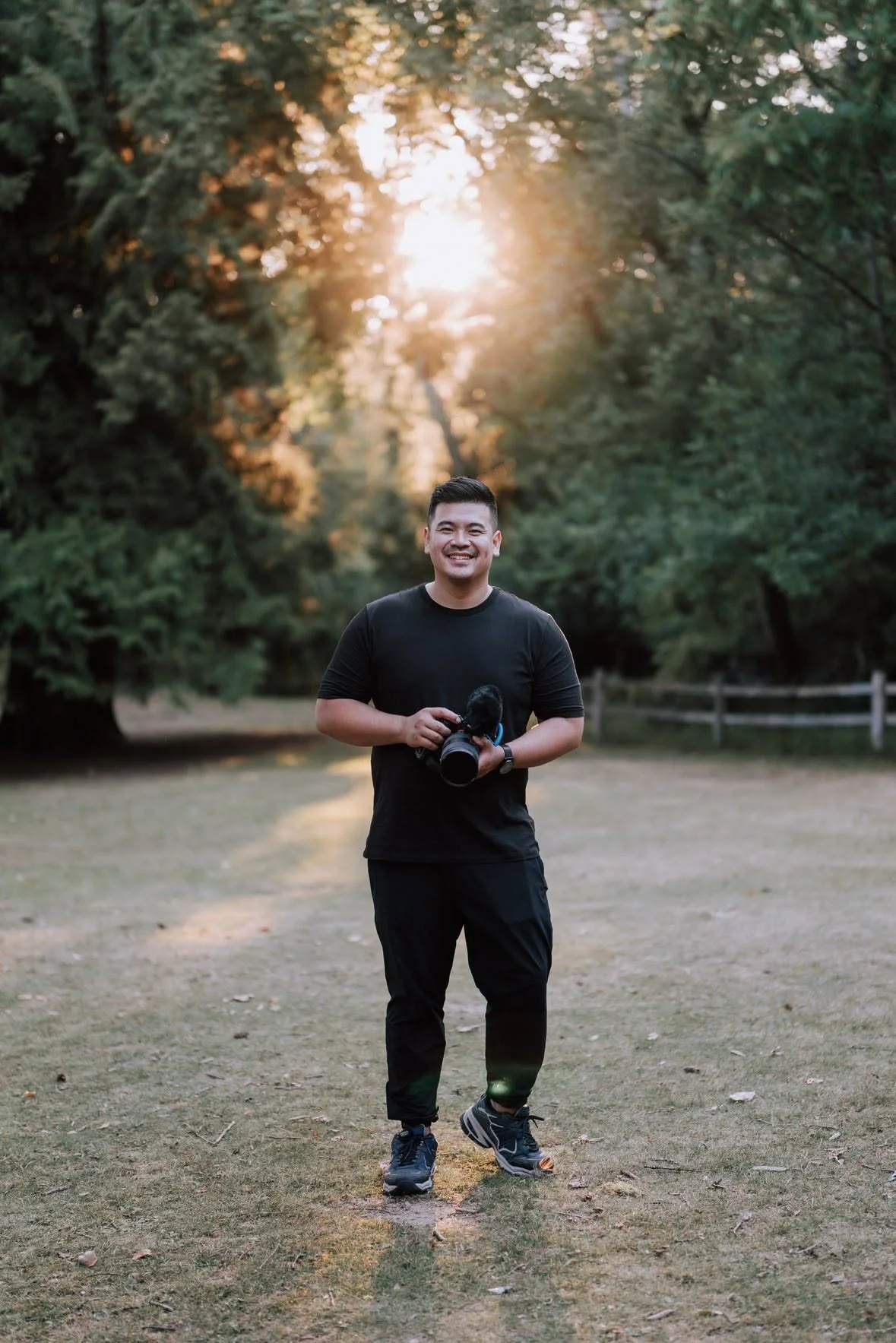 Edmonton wedding videographer filming a couple at an outdoor wedding ceremony with a professional camera