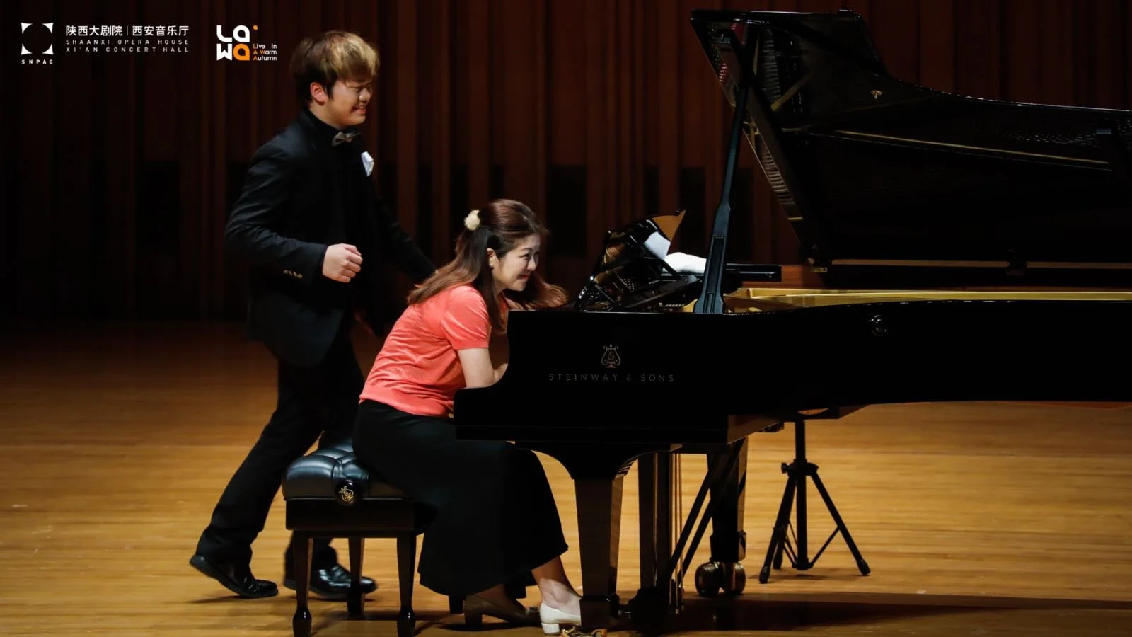 Hao Rao performing with his teacher Vivian Li, piano recital in Xi An. 