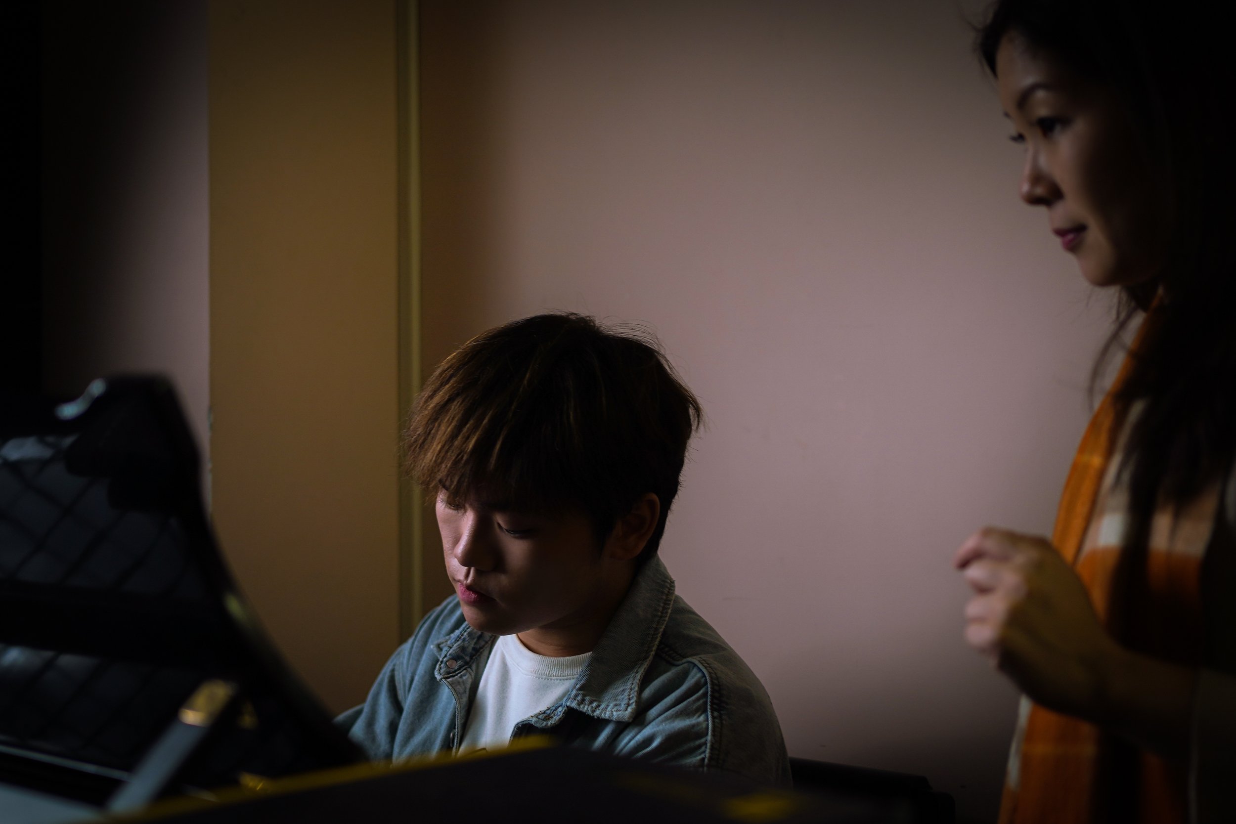 Hao Rao in a piano lesson with teacher Vivian Li