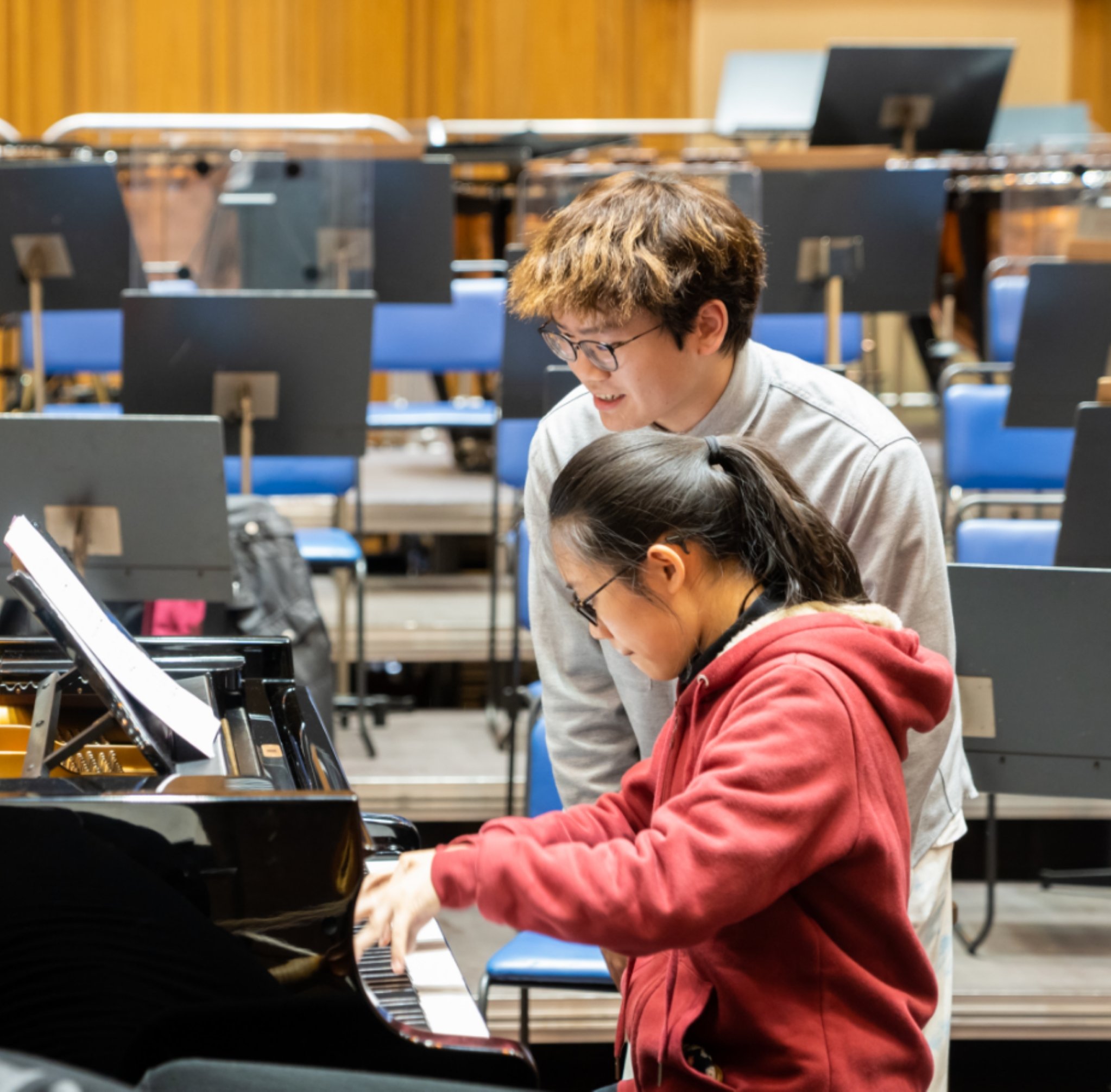Hao Rao and Yanyan Bao practicing piano at rehearsal.