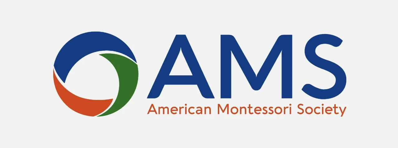Logo of the American Montessori Society featuring a circular design with blue, green, and red segments and the text 'AMS' and 'American Montessori Society' underneath.