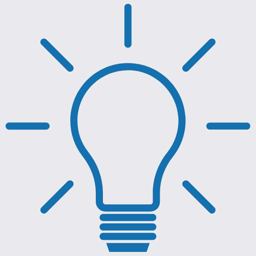 Outline of a light bulb with rays emanating from it.