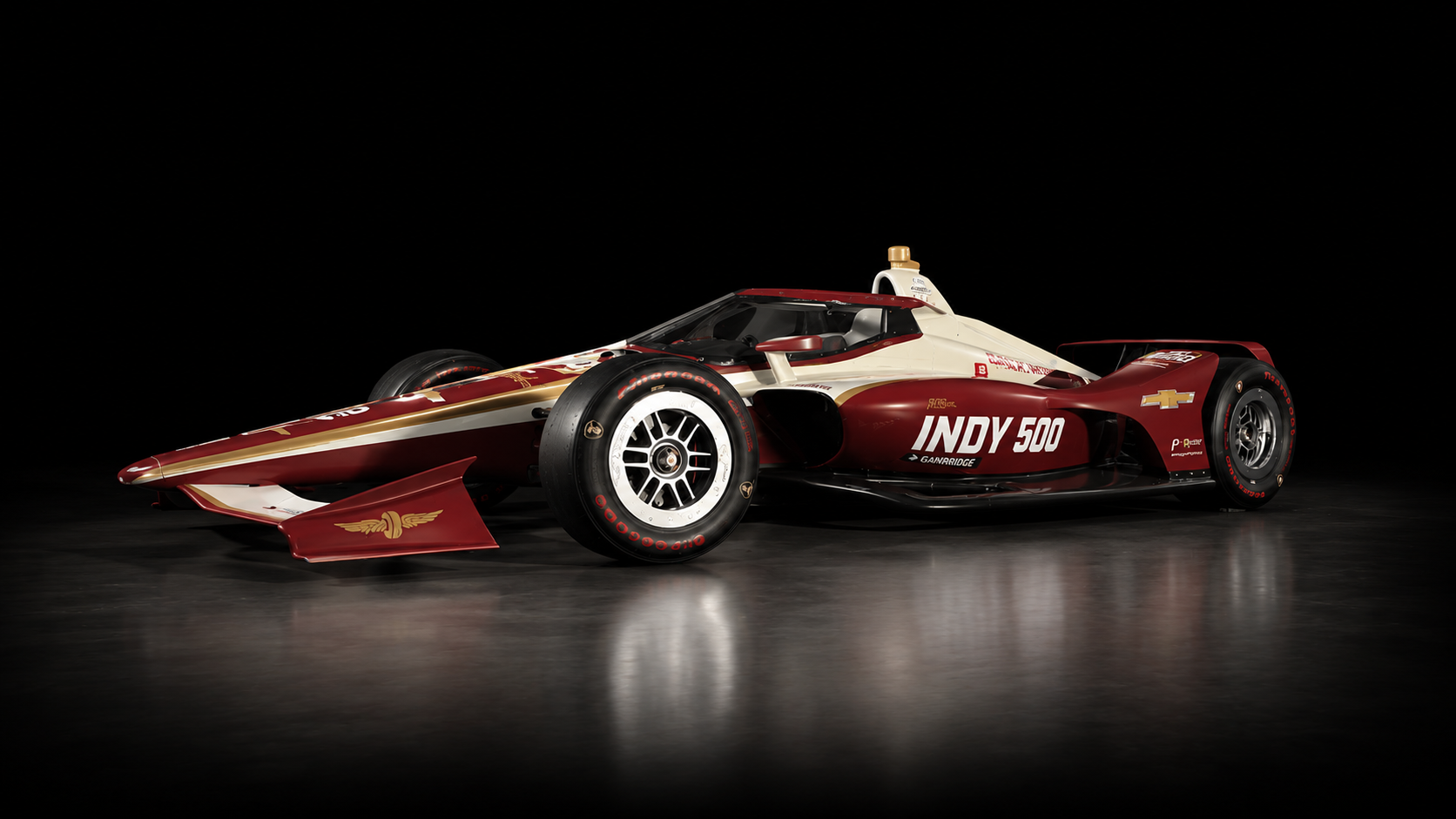 Indy 500 race car with custom maroon, gold and cream graphics produced by Indy Wrap Works.