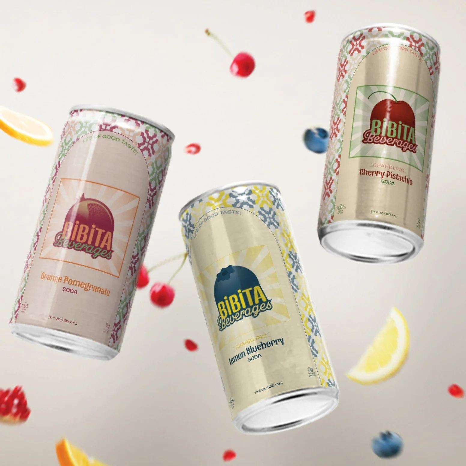 Three cans of Bibita sparkling beverages with flavors Orange Pomegranate, Lemon Blueberry, and Cherry Pistachio floating against a light background with scattered fruit slices and berries.