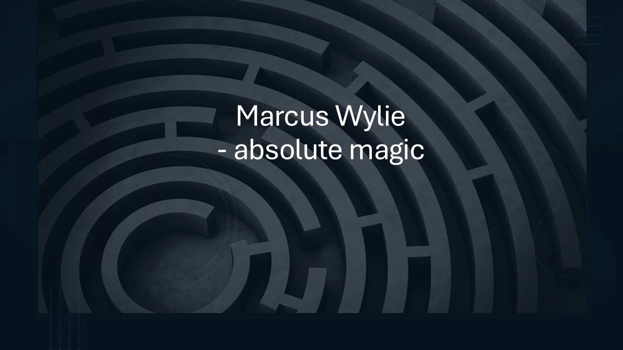 Cover slide with a dark maze background displaying the text 'Marcus Wylie - absolute magic' in white over the center.