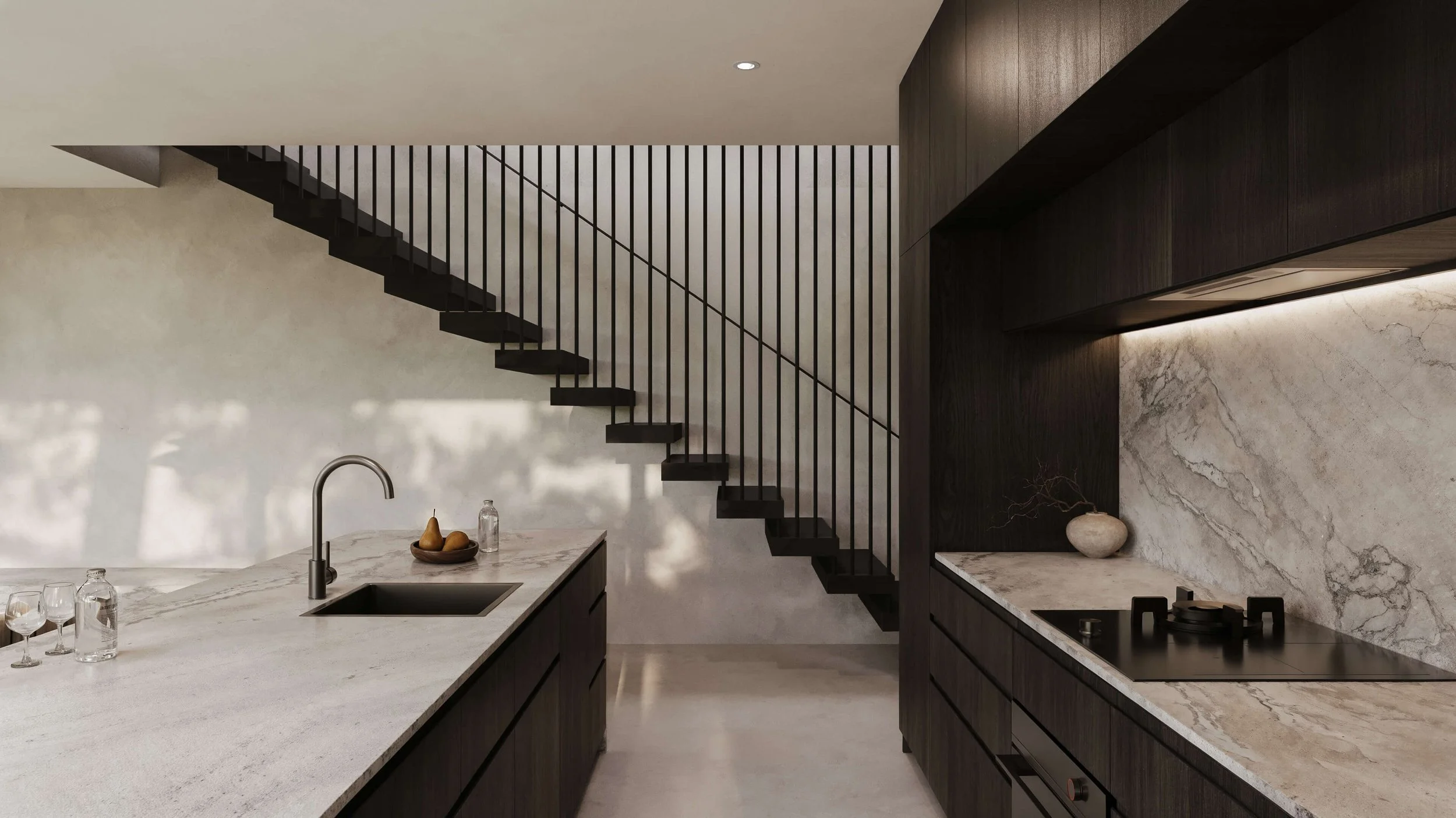 Modern kitchen with dark wood cabinets, marble countertops, and a staircase with black metal railings.