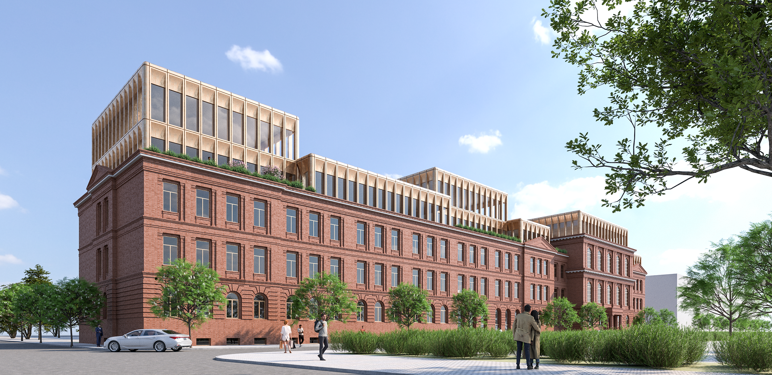 A multi-story building with a red brick lower section and modern glass upper section, surrounded by trees, people walking, and a car parked nearby under a blue sky with few clouds.