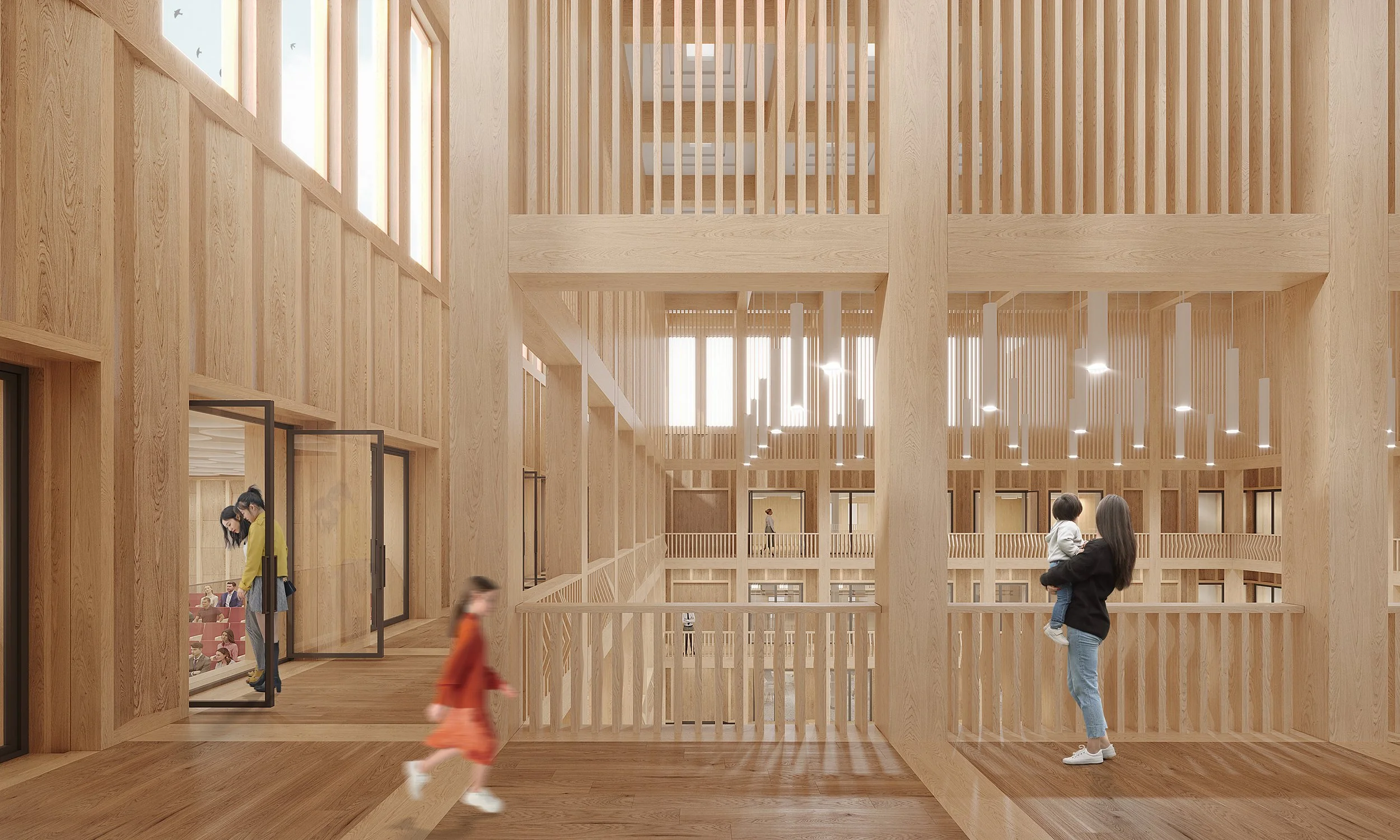 Interior of a multi-story wooden building with open balconies, large windows, and hanging lights. A woman is holding a small child, and two children are walking and looking around.