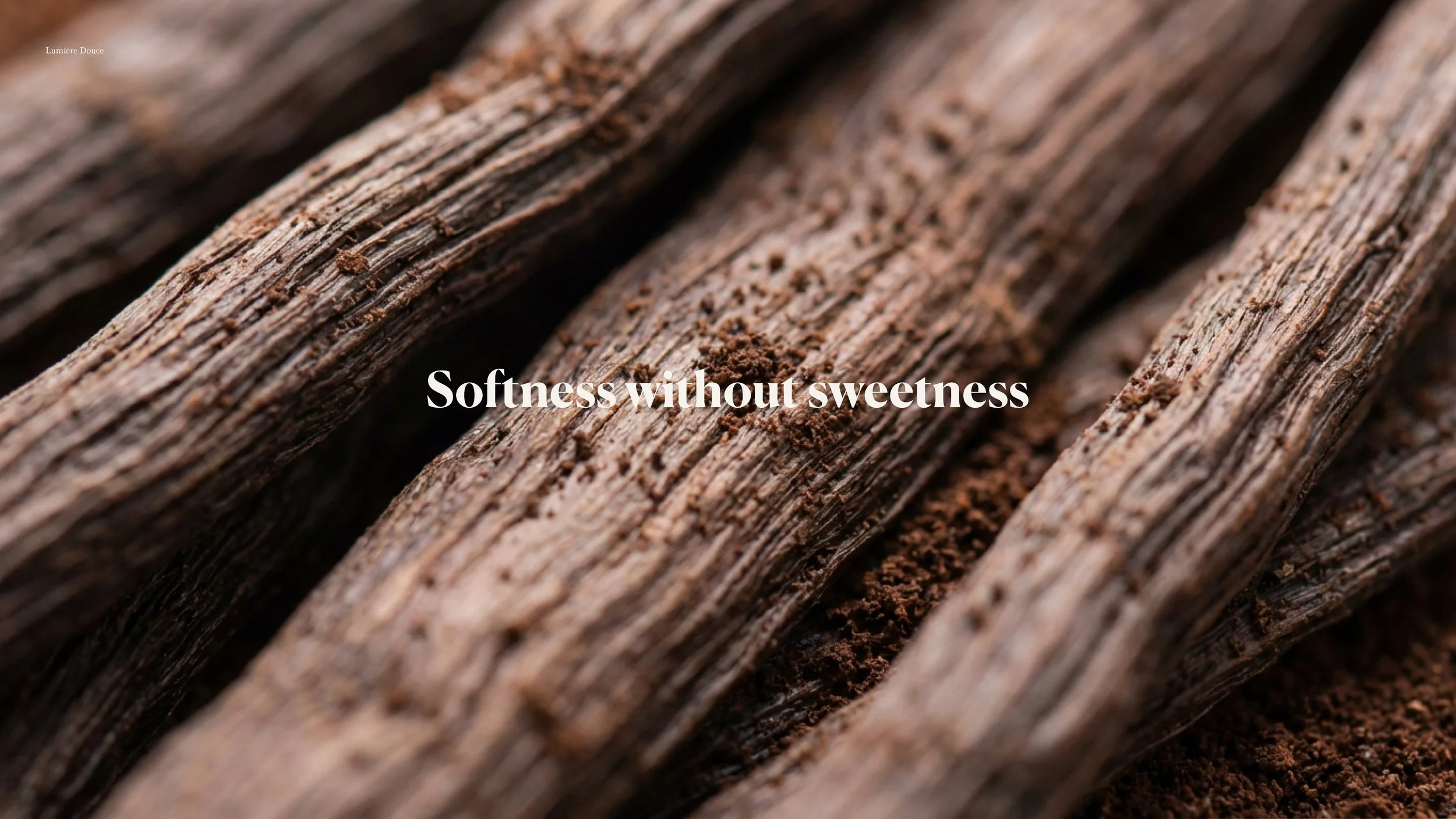 Close-up of textured cinnamon sticks with ground cinnamon and the text "Softness wilhout sweetness" overlaid.