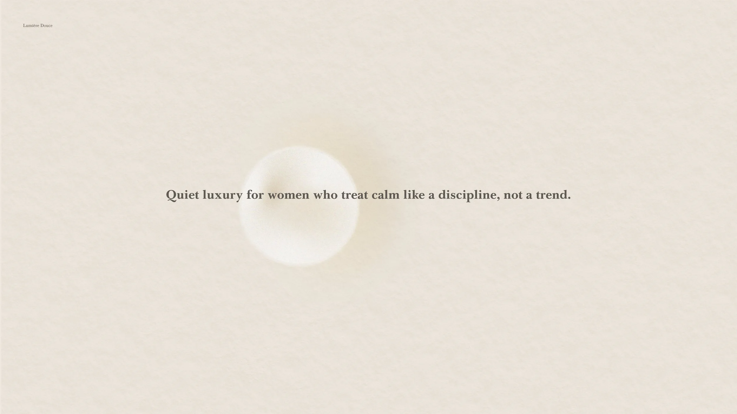 Minimalist webpage with a soft beige background and a subtle light circle in the center, containing the text: 'Quiet luxury for women who treat calm like a discipline, not a trend.'