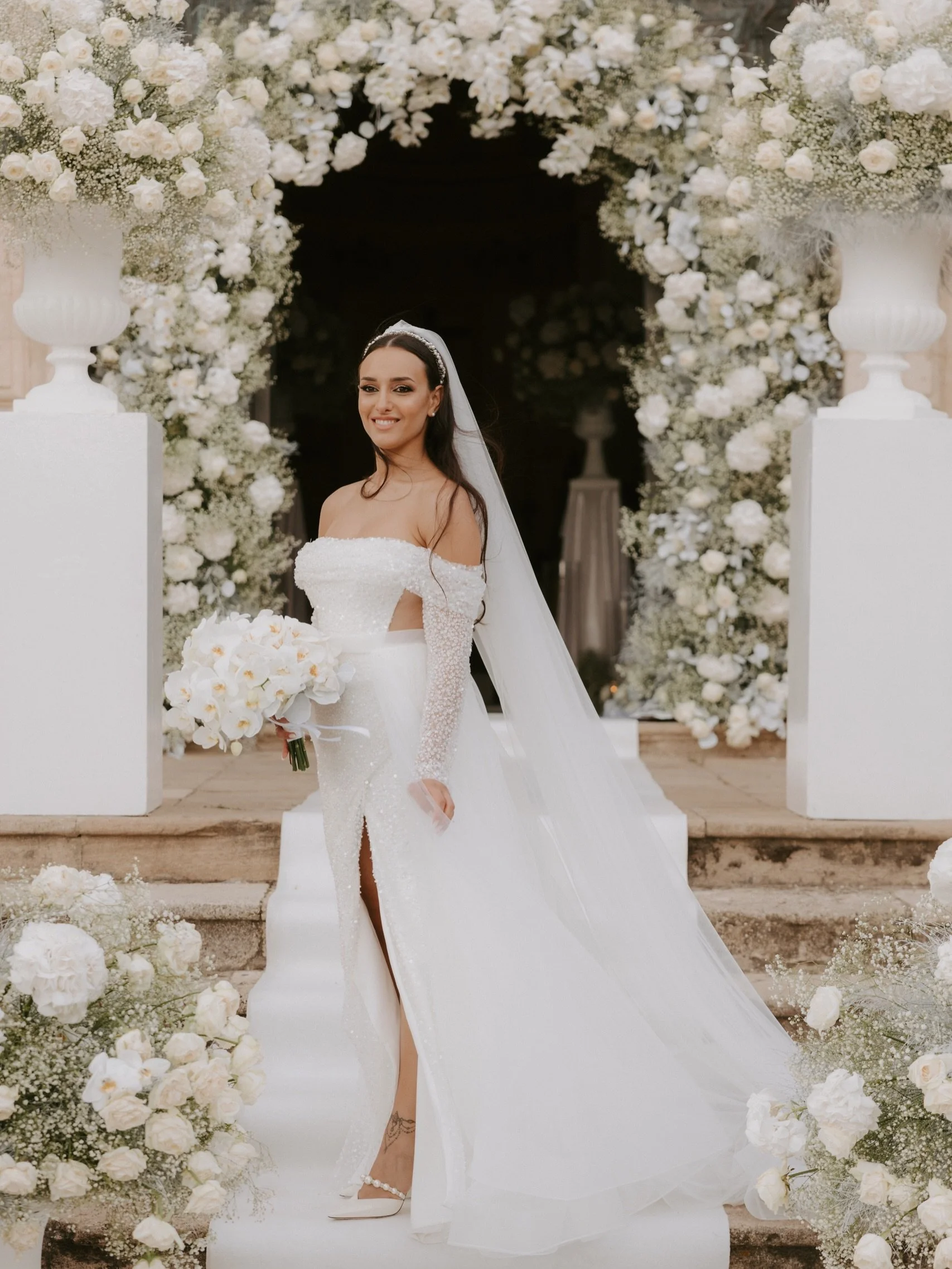 A veil that dances with every step, soft florals framing a moment suspended in time.
An entrance designed to feel effortless, romantic and unforgettable where every detail speaks the language of elegance. ✨🤍

For brides who dream of timeless beauty 