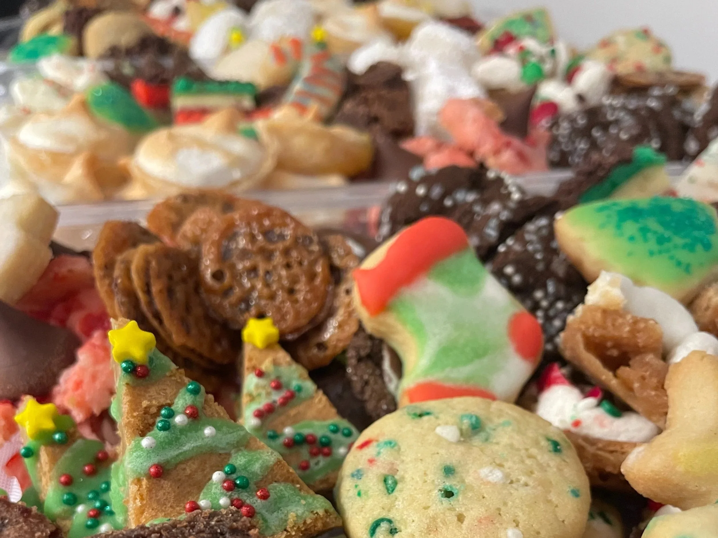 Christmas Cookies from The Merry Berry Confection Co in Boone NC and Cary NC. Pictured are brown butter blondies, lace cookies, venetians, and others.