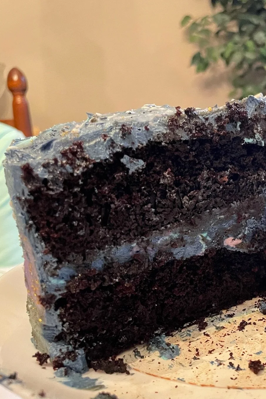 A slice of the Galactic Cake shows its moist, dark chocolate cake and the swirling, marbled icing between the layers - Merry Berry Confection Co, a micro-bakery specializing in holiday bakes and dessert bars for weddings and events near Raleigh, NC