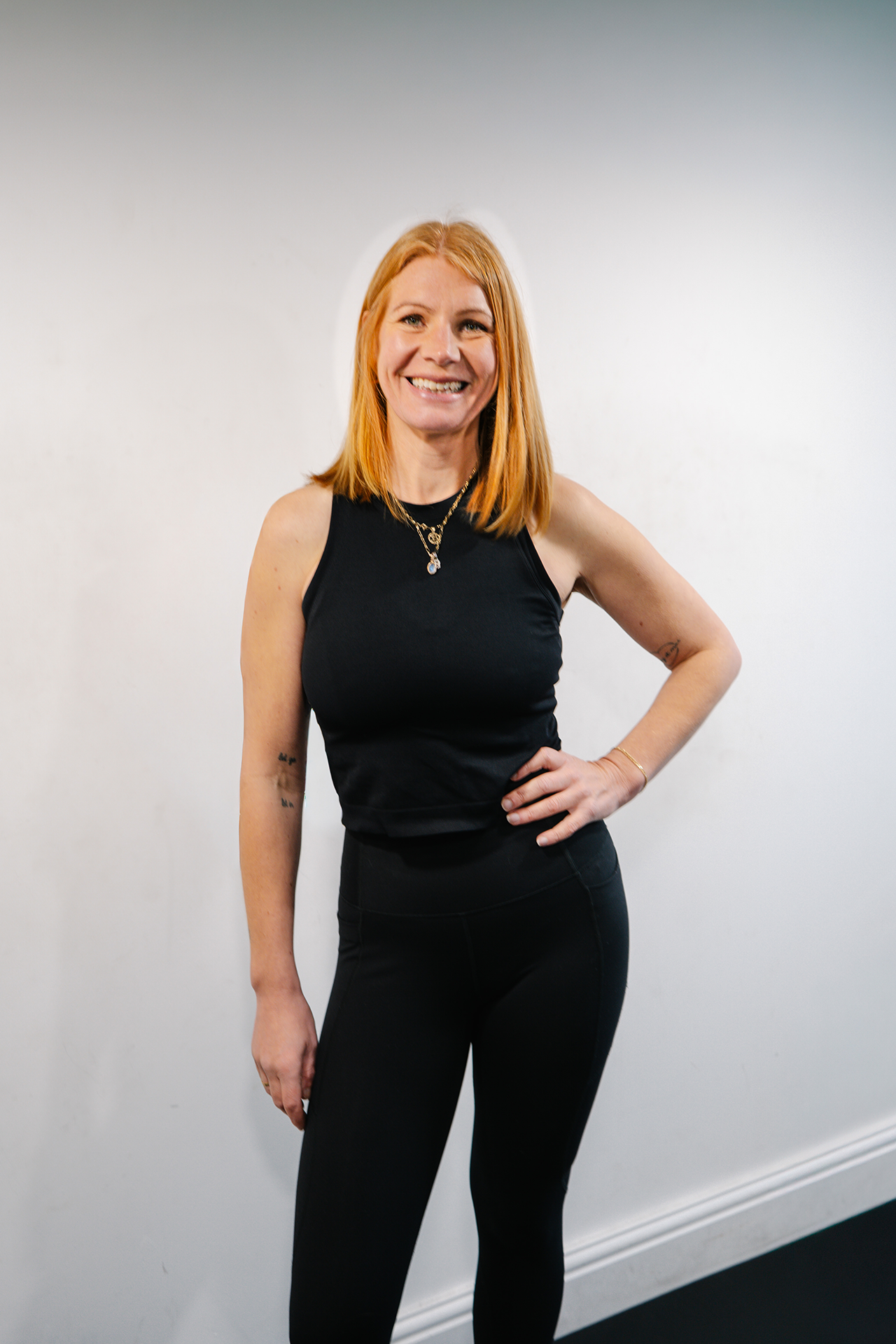 Ruby Tuttlebee, supportive personal trainer in East London, smiling in the gym