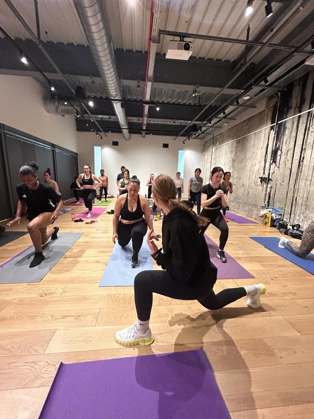 Ruby Tuttlebee leading a fun and inclusive group fitness class in East London
