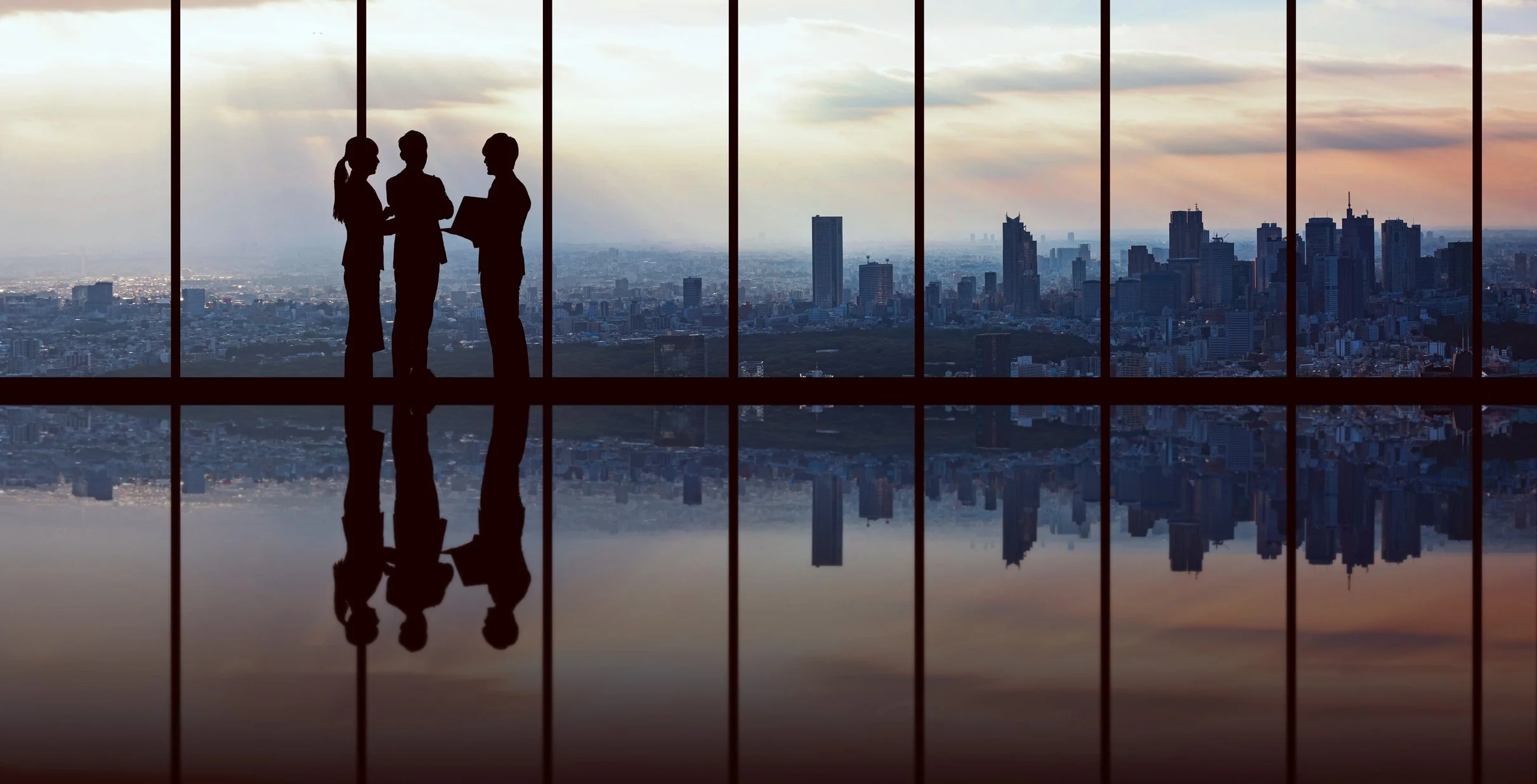 Leaders reflecting together on leadership direction and responsibility in a coaching context.