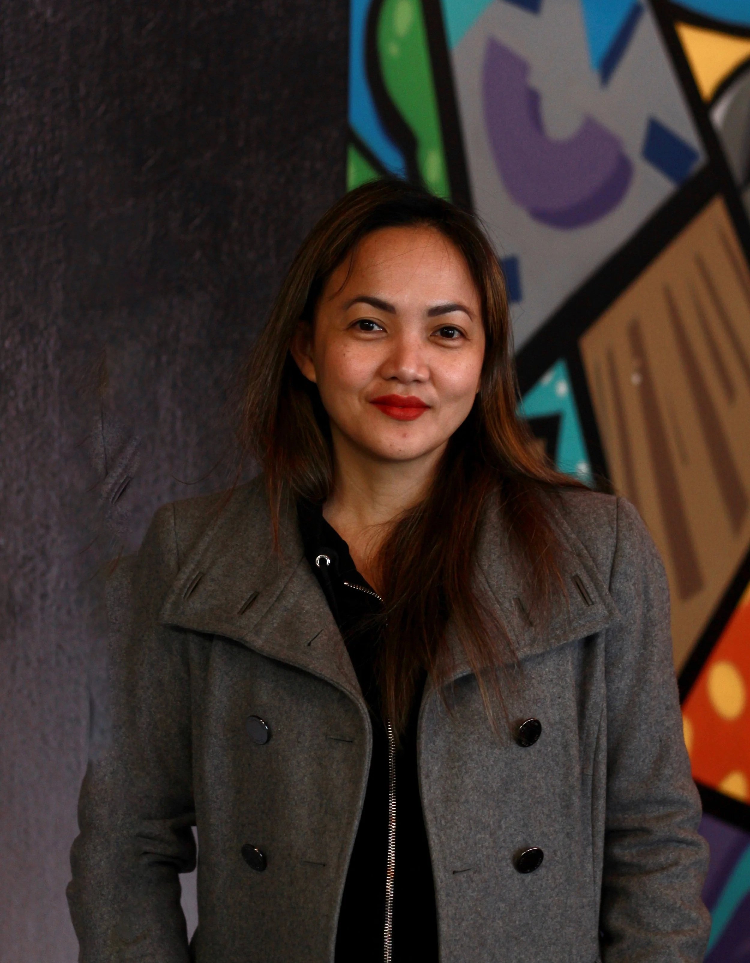 Gail Manigsaca smiling during networking event in Kingston, ON