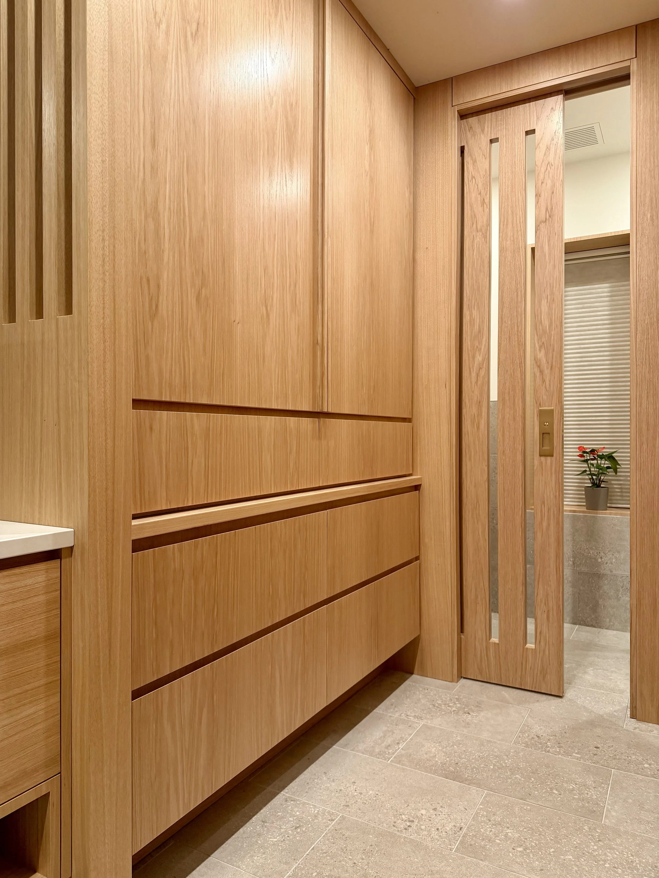 Mirrored Grain-Matched Wardrobe & Pocket Door and Architectural Partition Walls in Uniform Hickory Veneer & Hardwood Finished with Centurion 2K Polyurethane.

Bathroom Remodeling and Design Project Completed in Northville MI