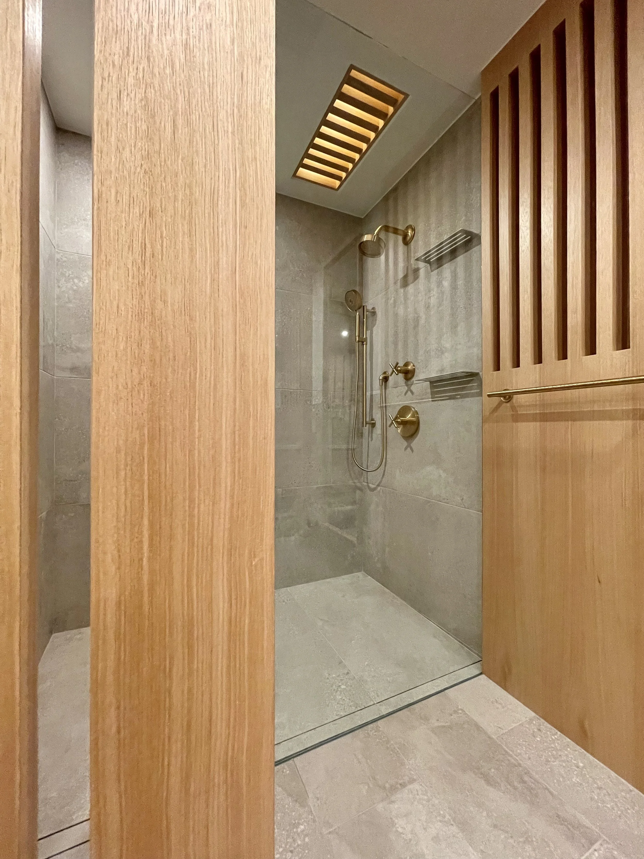 Architectural Details in Uniform Hickory Veneer and Hickory Heartwood Finished with Centurion 2K Polyurethane.

Wall Mounted Fixtures are Kohler Purist in Vibrant Brushed Modern Gold. 

Scandinavian Inspired Bathroom Remodeling Project Completed in N
