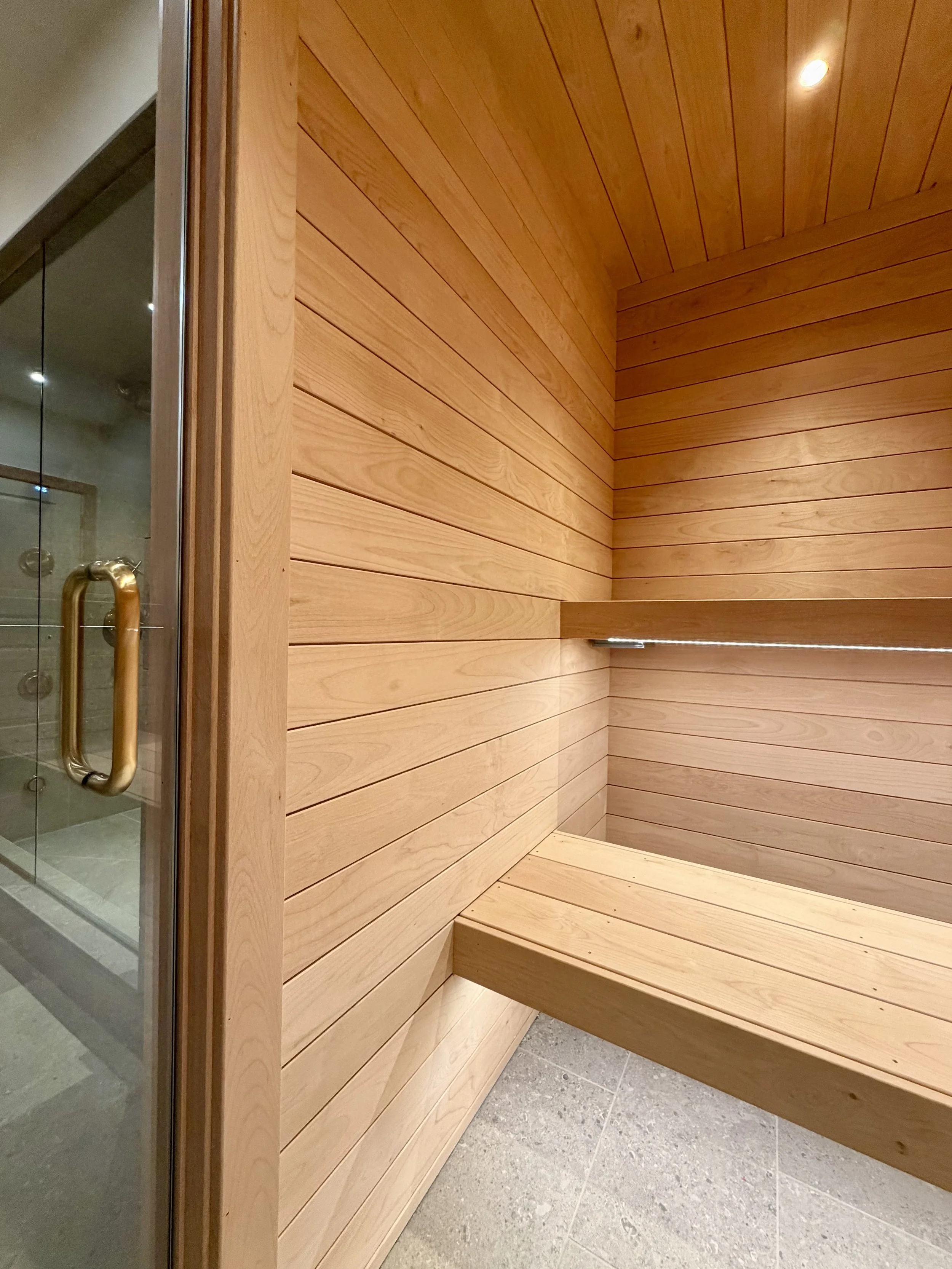 Architectural Details of Custom Built Sauna Using 3/4" X 4" Milled Tongue & Groove Alder Hardwood and Linear Benches Reinforced with Steel. 

Under-mount Bench Lighting and Recessed Ceiling Lights Painted to Match.

Custom Sauna Door in 1/2" Clear Gl