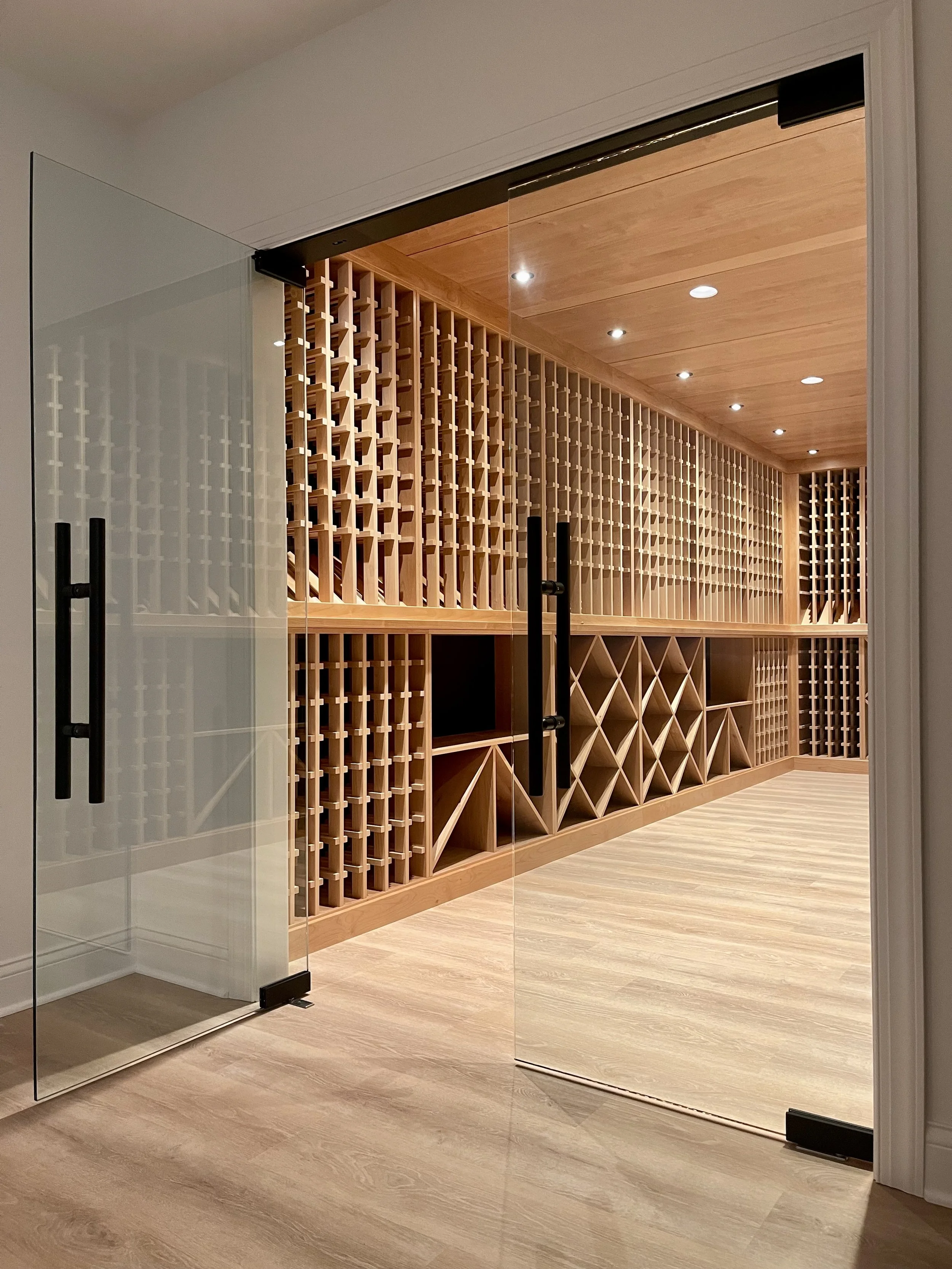 2000 Bottle Climate Controlled Custom Wine Cellar in Alder with Matte Black Background.

Custom Wine Cellar Project Completed in Northville MI. 