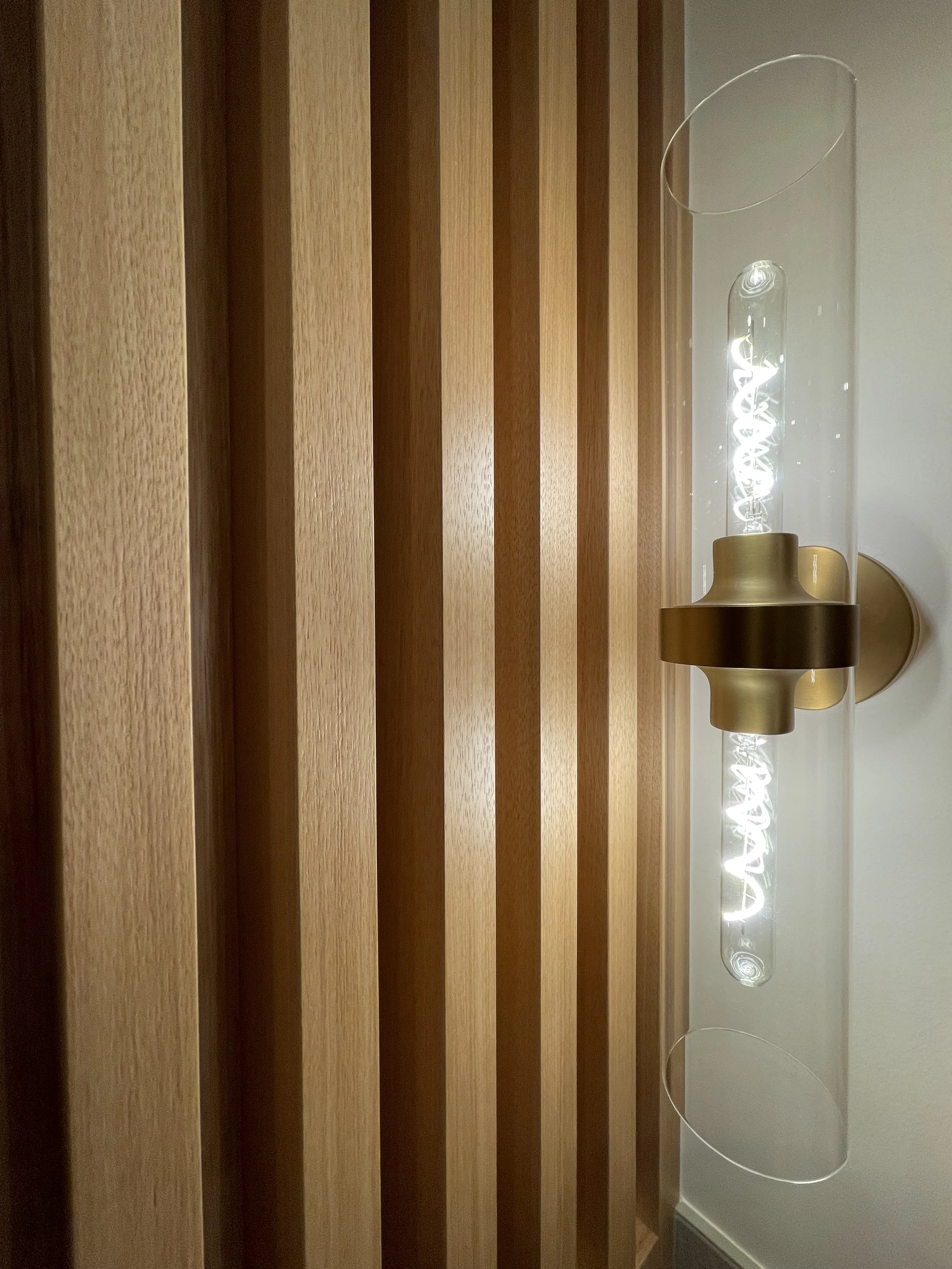 Architectural Detail in Uniform Hickory Veneer Finished with Centurion 2K Polyurethane.

Light Fixture is Kohler Purist in Vibrant Brushed Modern Gold. 

Project Completed in Northville MI. 
