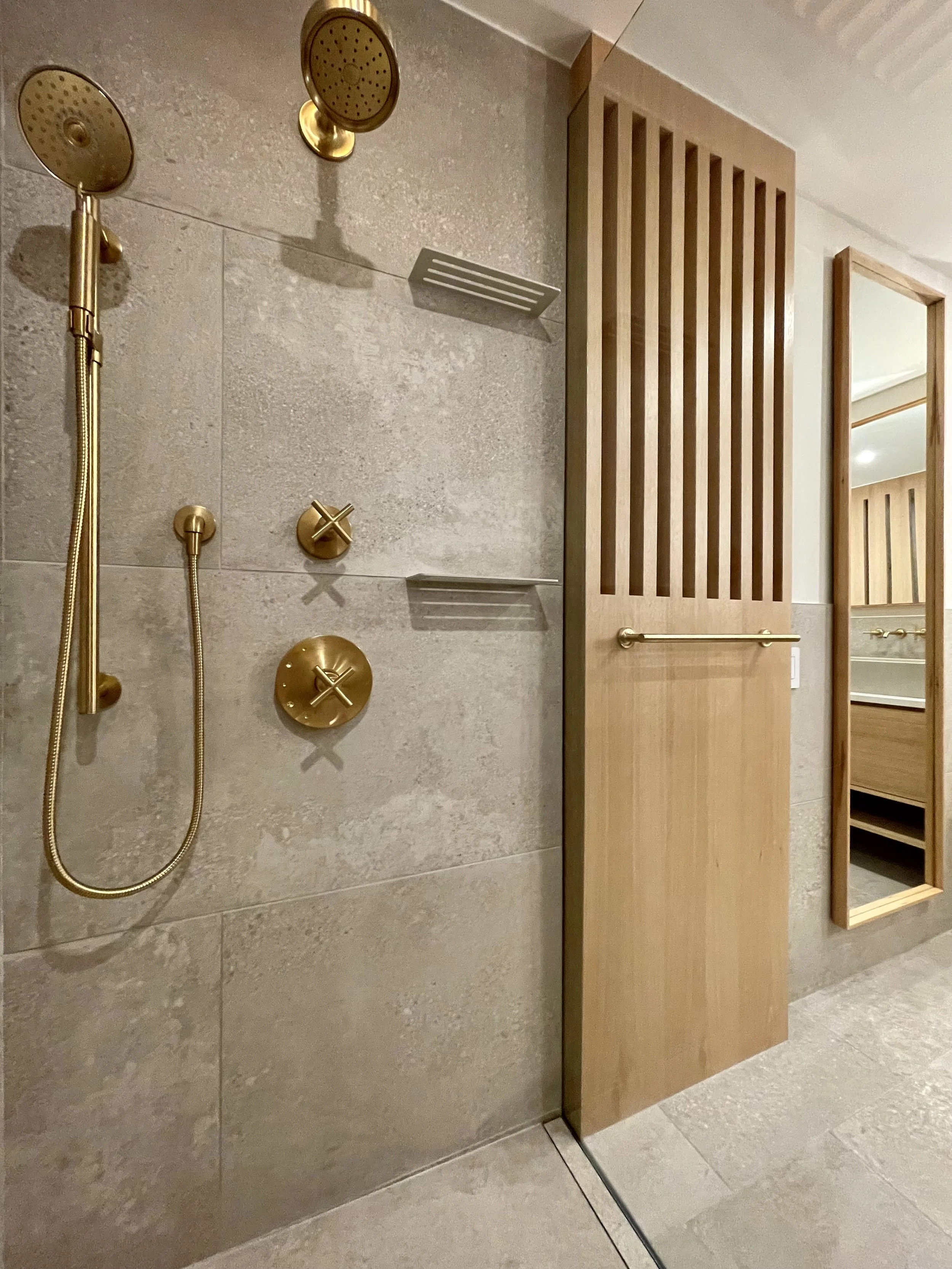 Architectural Detail in Uniform Hickory Veneer and Hickory Heartwood Finished with Centurion 2K Polyurethane.

Wall Mounted Plumbing Fixtures are Kohler Purist in Vibrant Brushed Modern Gold. 

Project Completed in Northville MI