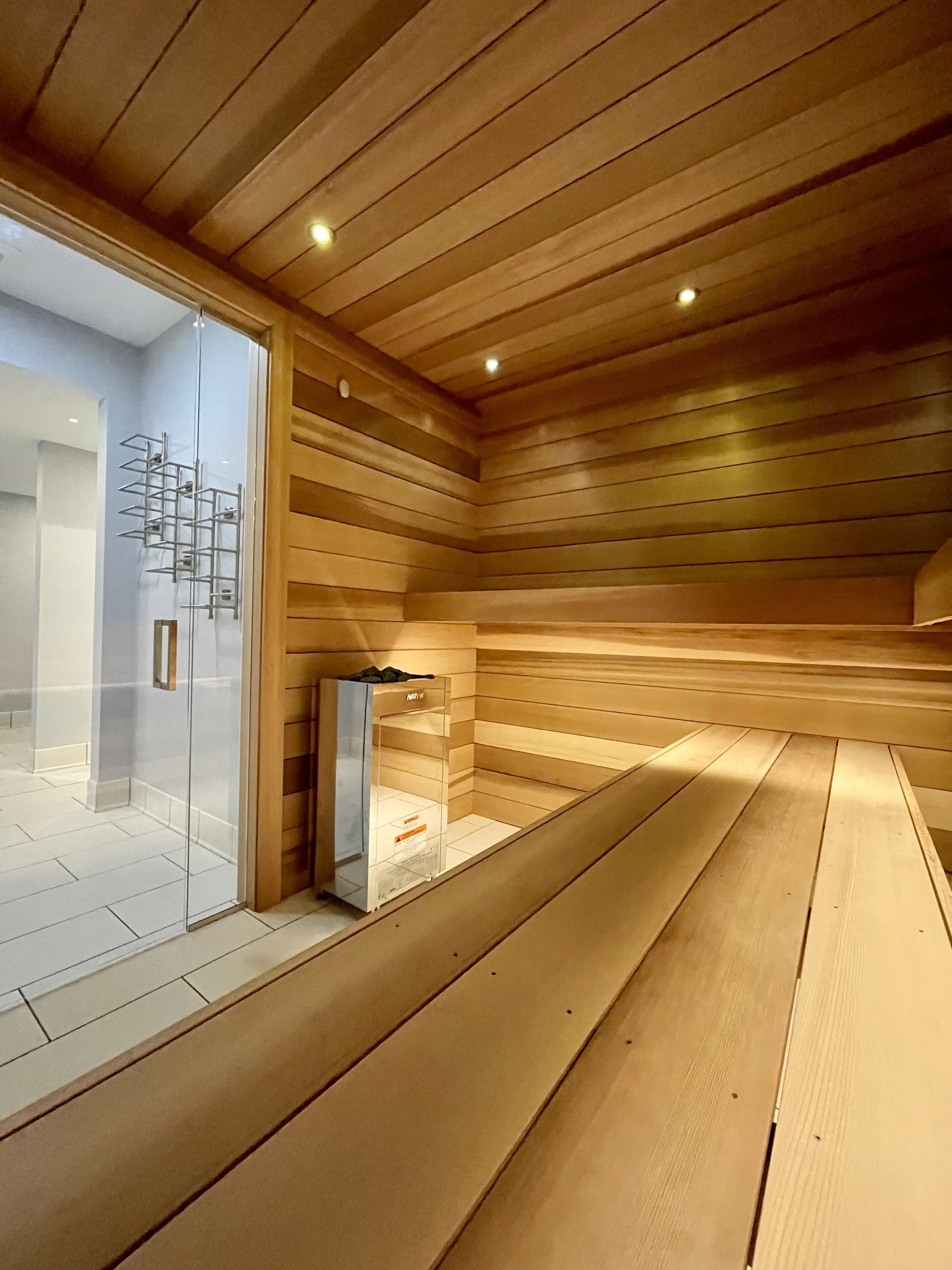 Architectural Details of Custom Built Sauna Using 3/4" X 5" Milled Tongue & Groove Cedar Hardwood and Linear Benches Reinforced with Steel. 

Under-mount Bench Lighting and Recessed Ceiling Lights Painted to Match.

Custom Sauna Door and Side-Lights 