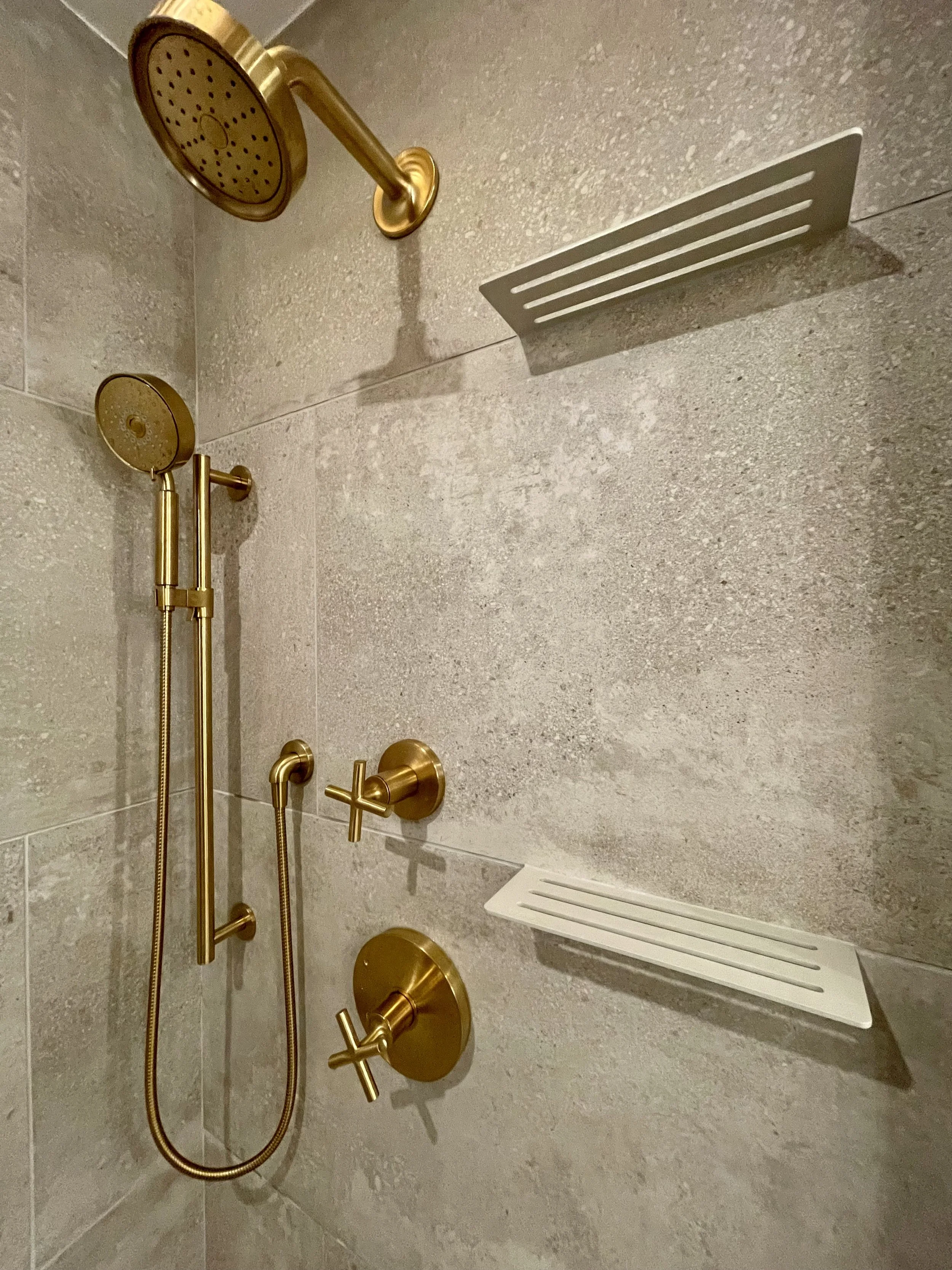 Architectural Detail in Uniform Hickory Veneer and Hickory Heartwood Finished with Centurion 2K Polyurethane.

Wall Mounted Plumbing Fixtures are Kohler Purist in Vibrant Brushed Modern Gold. 

Schluter SHELF-W in Wave Greige

Project Completed in No