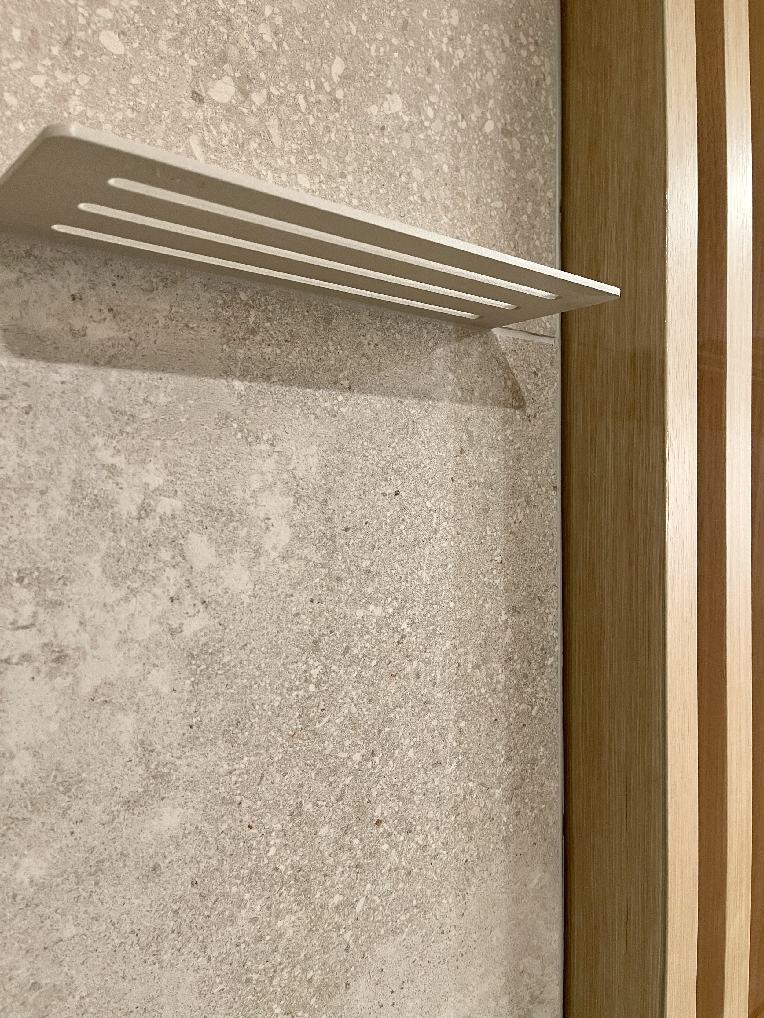 Architectural Detail in Uniform Hickory Veneer with 1/2" Clear Glass Finished with Centurion 2K Polyurethane.

Schluter SHELF-W in Wave Greige

Bathroom Remodeling Project Completed in Northville MI