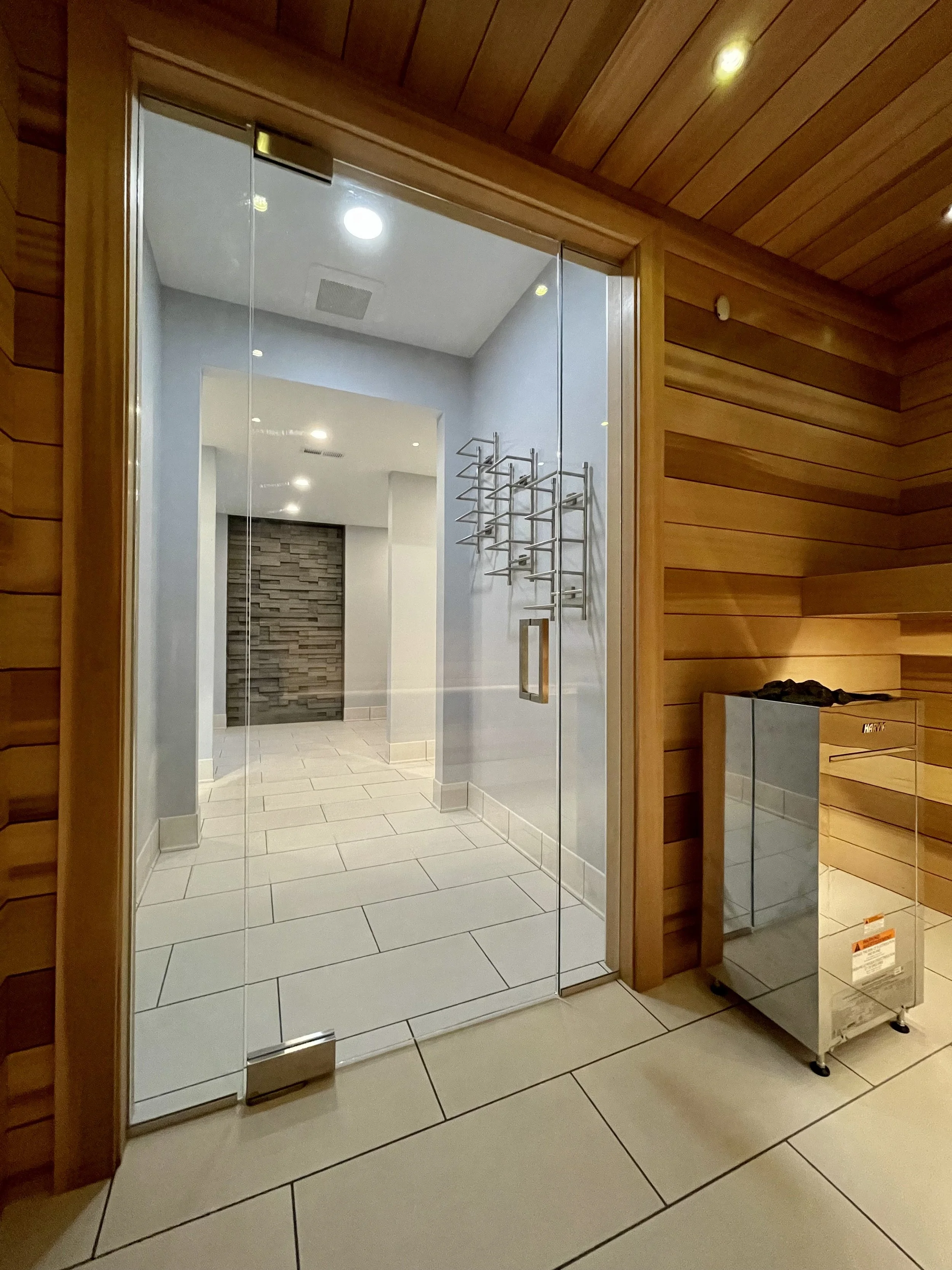 Architectural Details of Custom Built Sauna Using 3/4" X 5" Milled Tongue & Groove Cedar Hardwood and Linear Benches Reinforced with Steel. 

Under-mount Bench Lighting and Recessed Ceiling Lights Painted to Match.

Custom Sauna Door and Side-Lights 