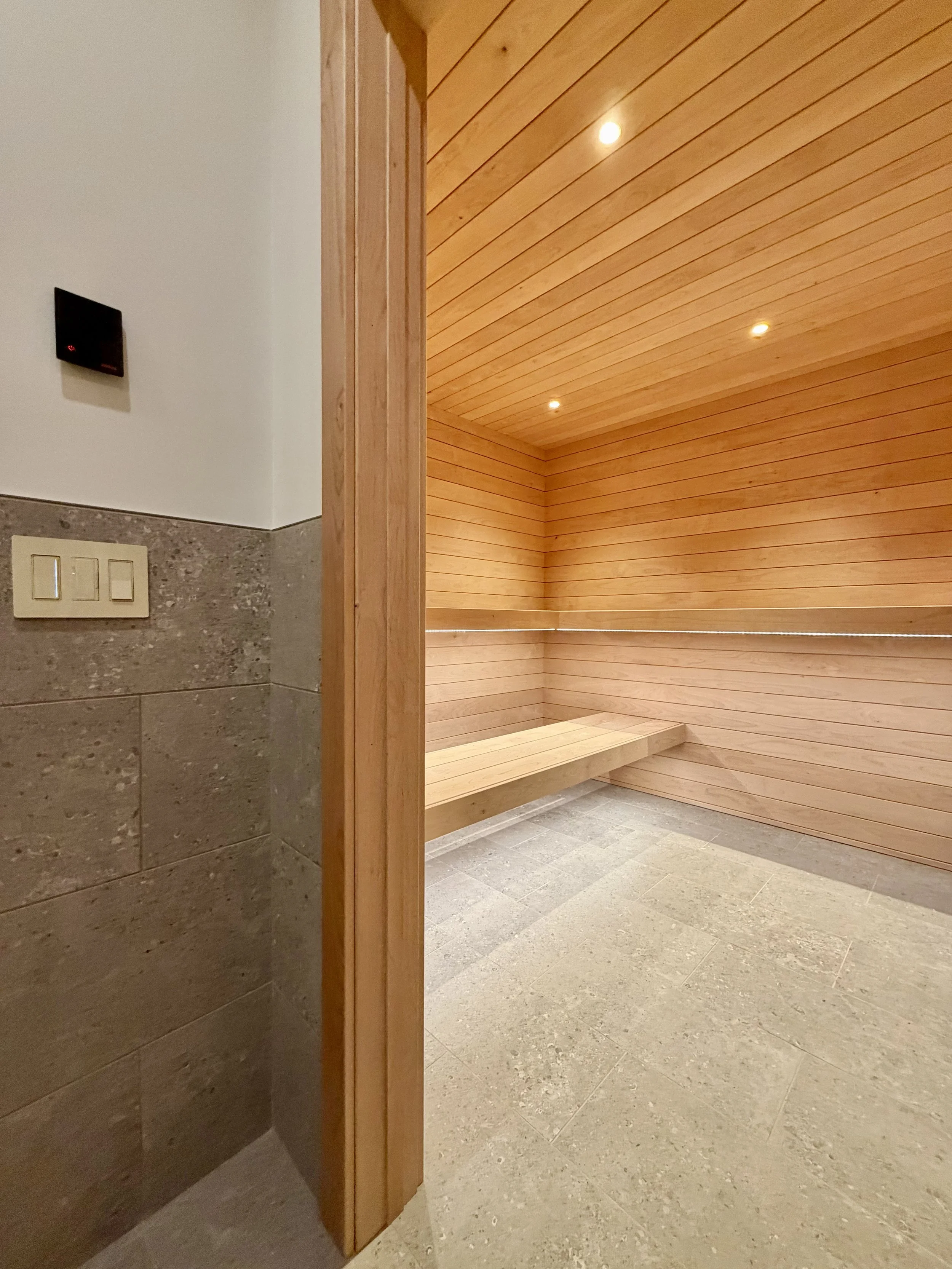 Architectural Details of Custom Built Sauna Using 3/4" X 4" Milled Tongue & Groove Alder Hardwood and Linear Benches Reinforced with Steel. 

Under-mount Bench Lighting and Recessed Ceiling Lights Painted to Match.

Custom Sauna Door in 1/2" Clear Gl