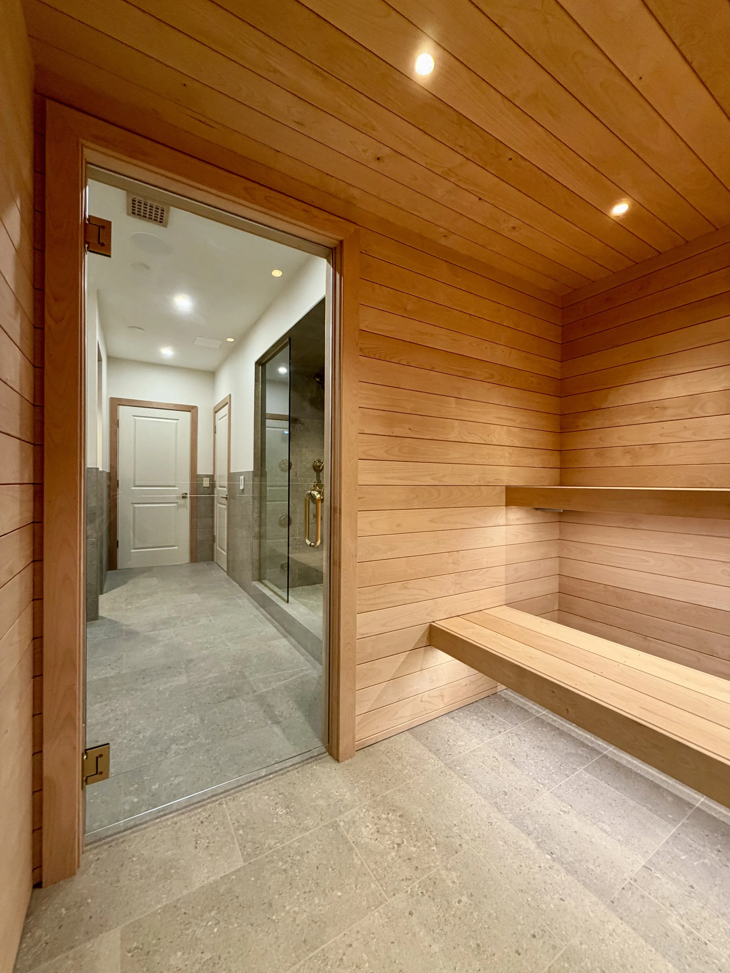 Architectural Details of Custom Built Sauna Using 3/4" X 4" Milled Tongue & Groove Alder Hardwood and Linear Benches Reinforced with Steel. 

Under-mount Bench Lighting and Recessed Ceiling Lights Painted to Match.

Custom Sauna Door in 1/2" Clear Gl
