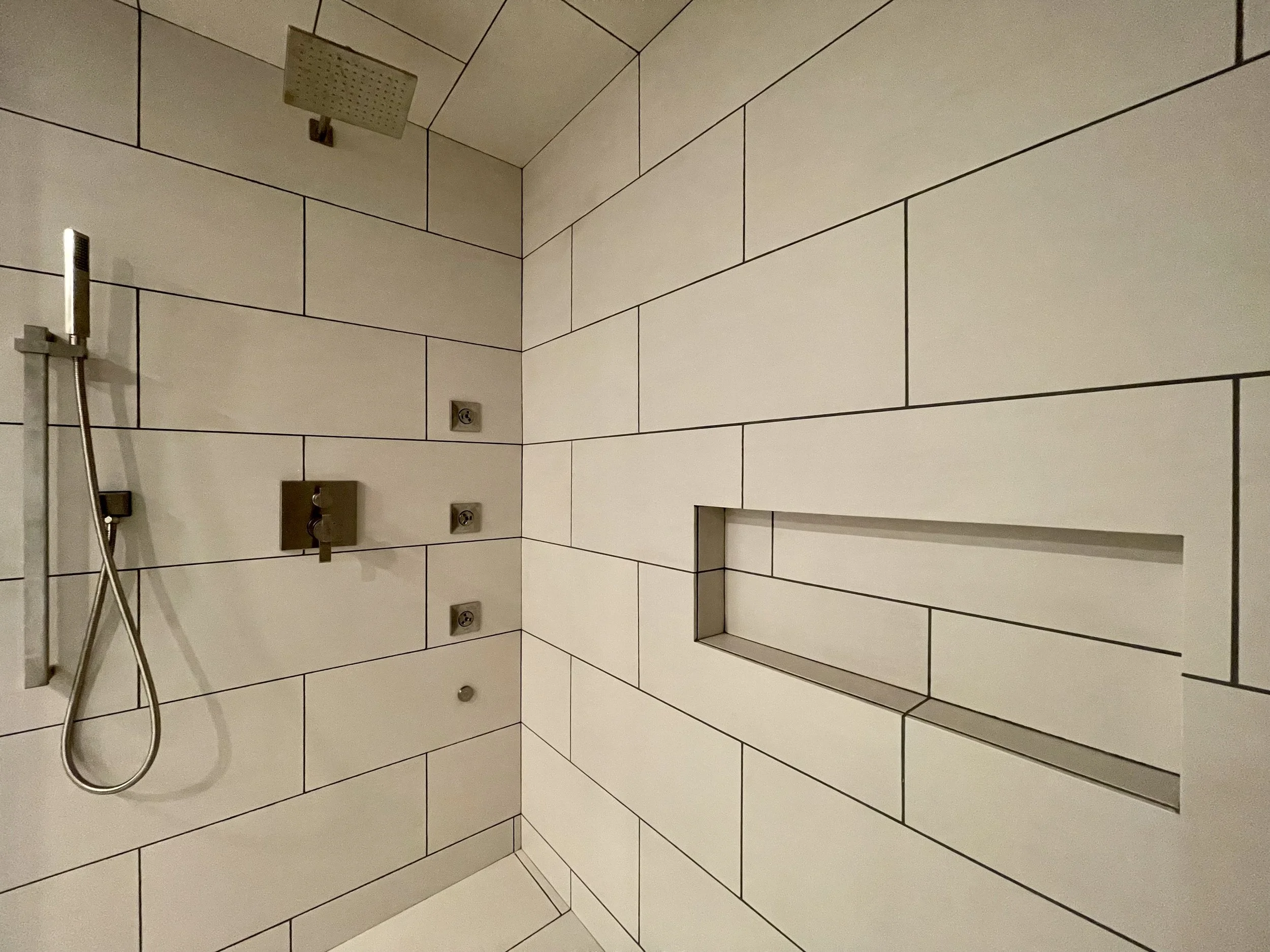 Custom Built Steam Shower with Steam Generator Control and Body Sprays by Kohler. 

Thermostatically Controlled Heated Floors Using Schluter DITRA-HEAT.

Scandinavian Inspired Bathroom Remodeling Project With Custom Sauna and Steam Shower Completed i