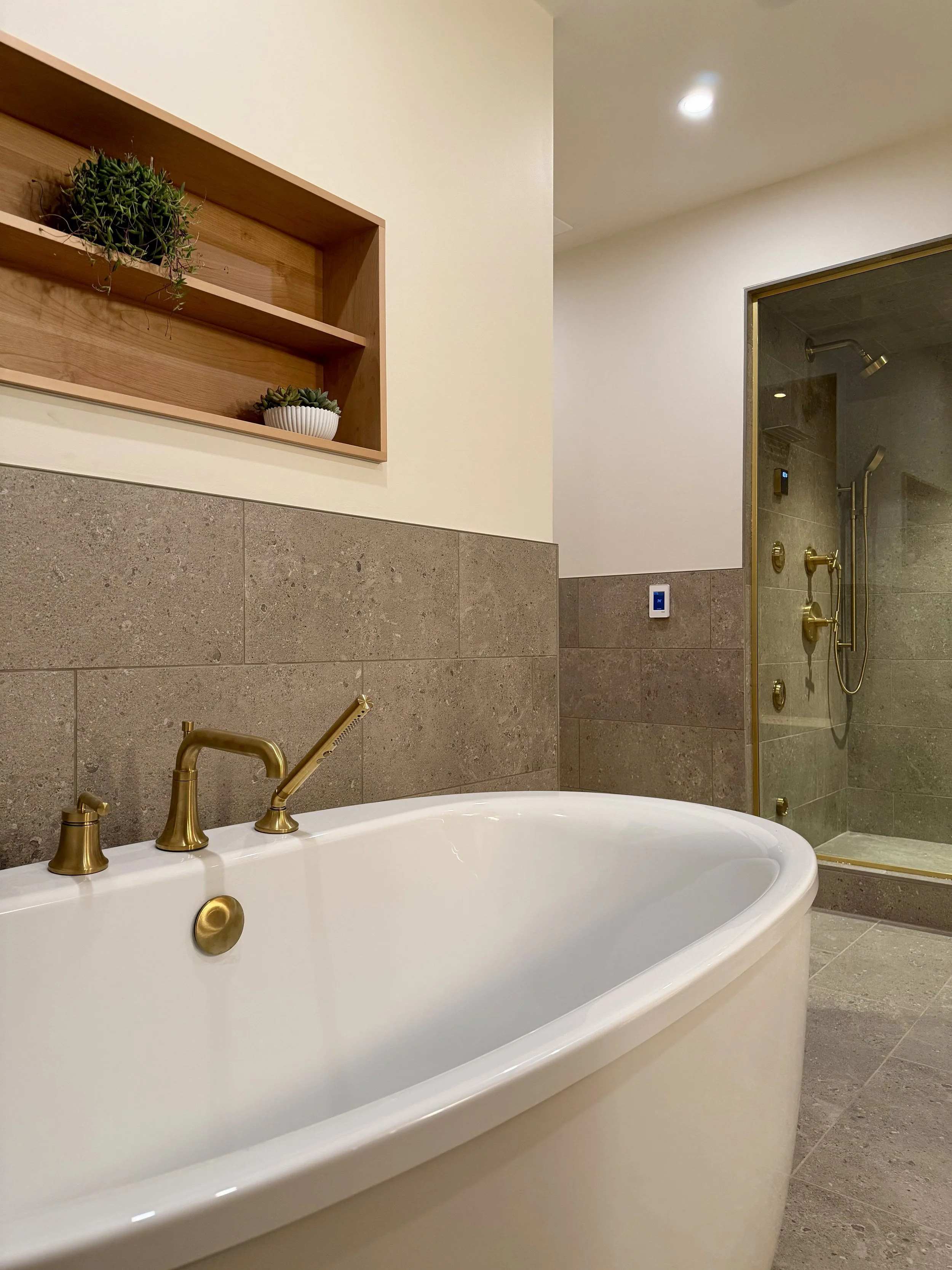 Kohler Soaking Tub Alcove with Purist Fixtures and 3/4" Edge-banded Alder Plywood Shelving Detail Finished with Centurion 2K Polyurethane. 

Thermostatically Controlled Heated Floors Using Schluter DITRA-HEAT.

Scandinavian Inspired Bathroom Remodeli