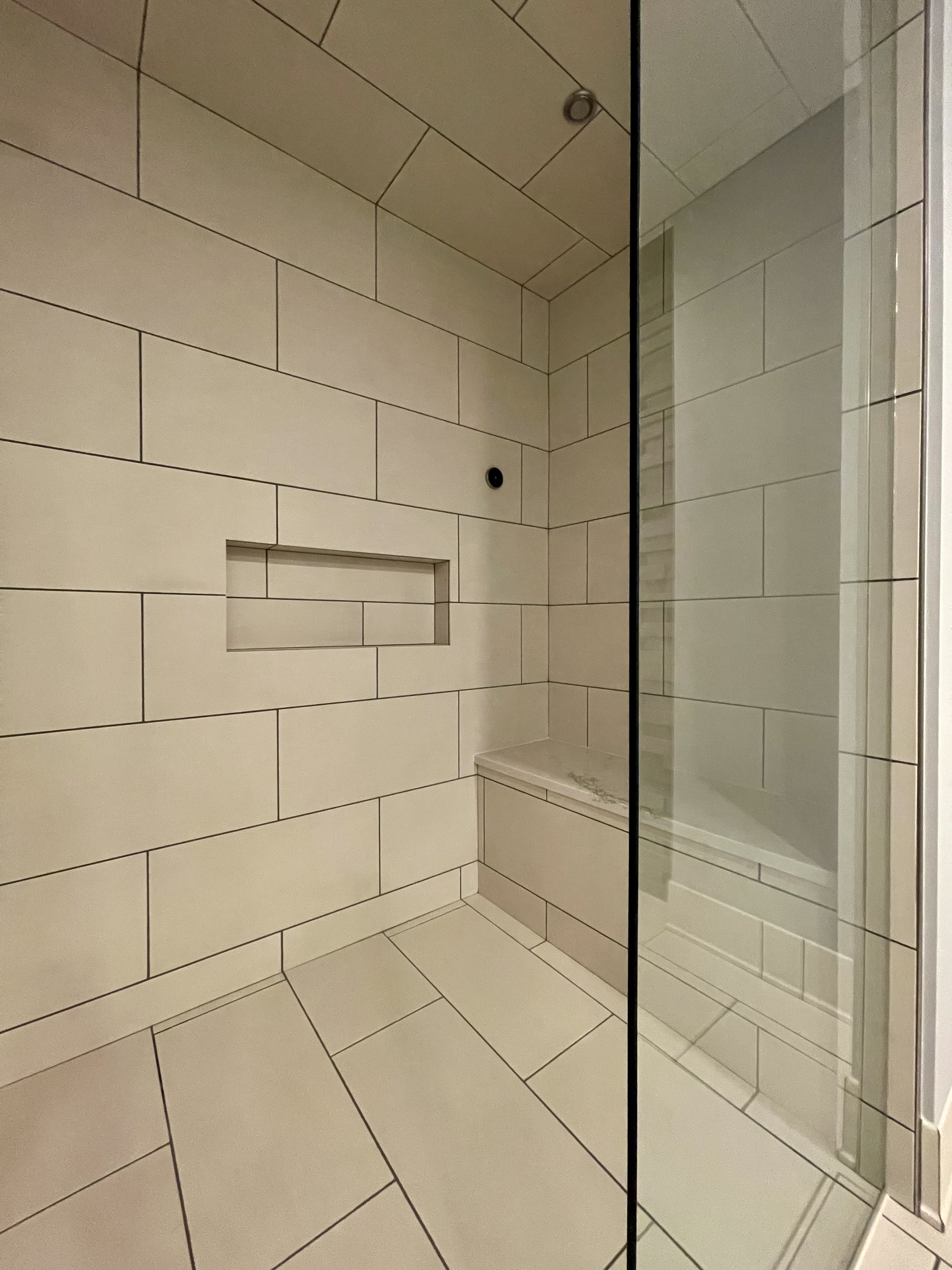 Custom Built Steam Shower with Steam Generator Control and Body Sprays by Kohler. 

Thermostatically Controlled Heated Floors Using Schluter DITRA-HEAT.

Scandinavian Inspired Bathroom Remodeling Project With Custom Sauna and Steam Shower Completed i