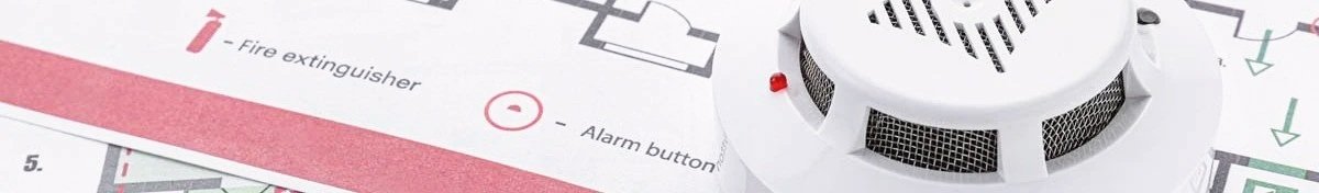 Fire alarm and fire extinguisher icon on a building floor plan.